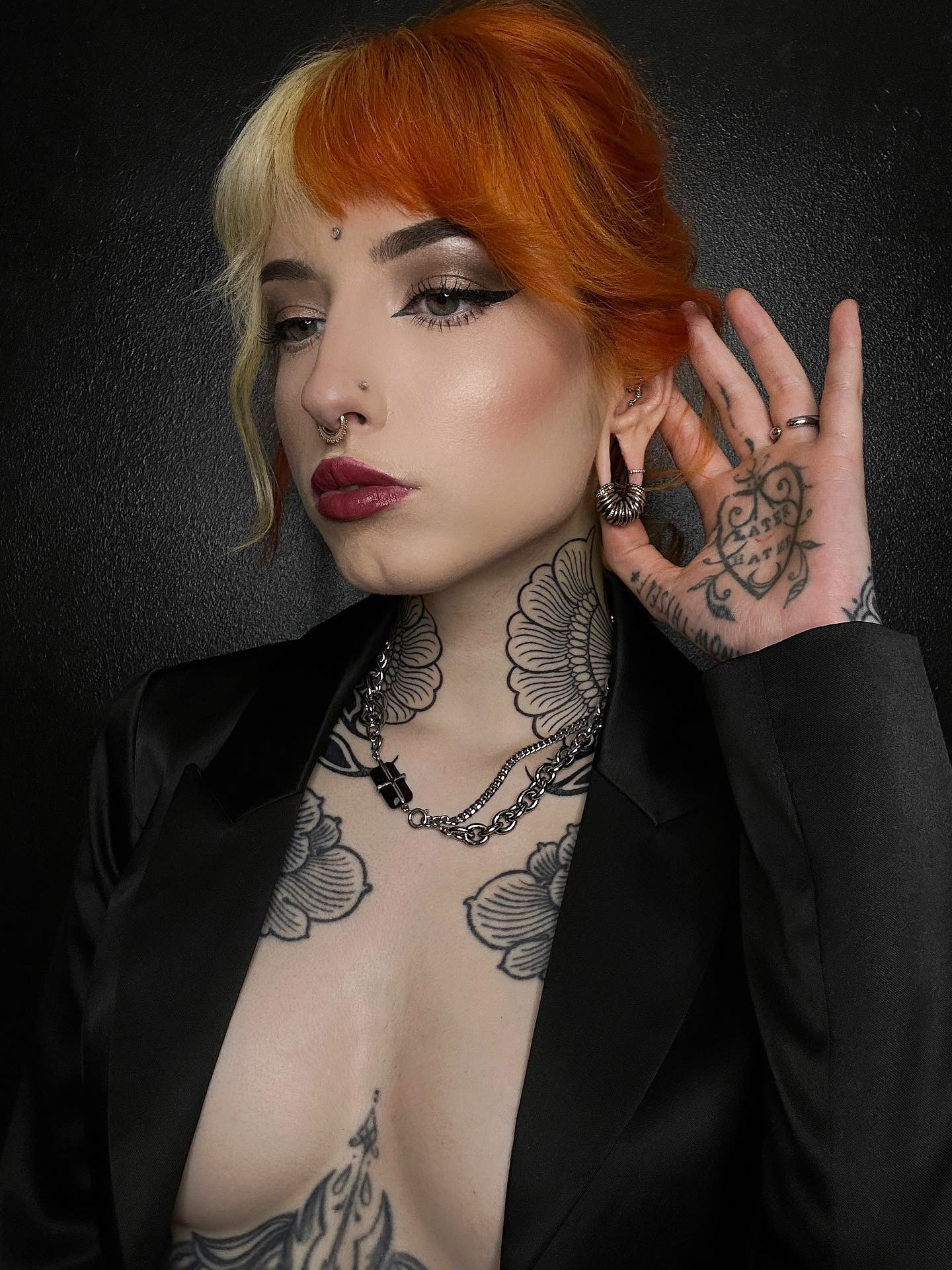 Tattooed woman wearing Gold Titanium Ring Stack - Small - (10 Rings)