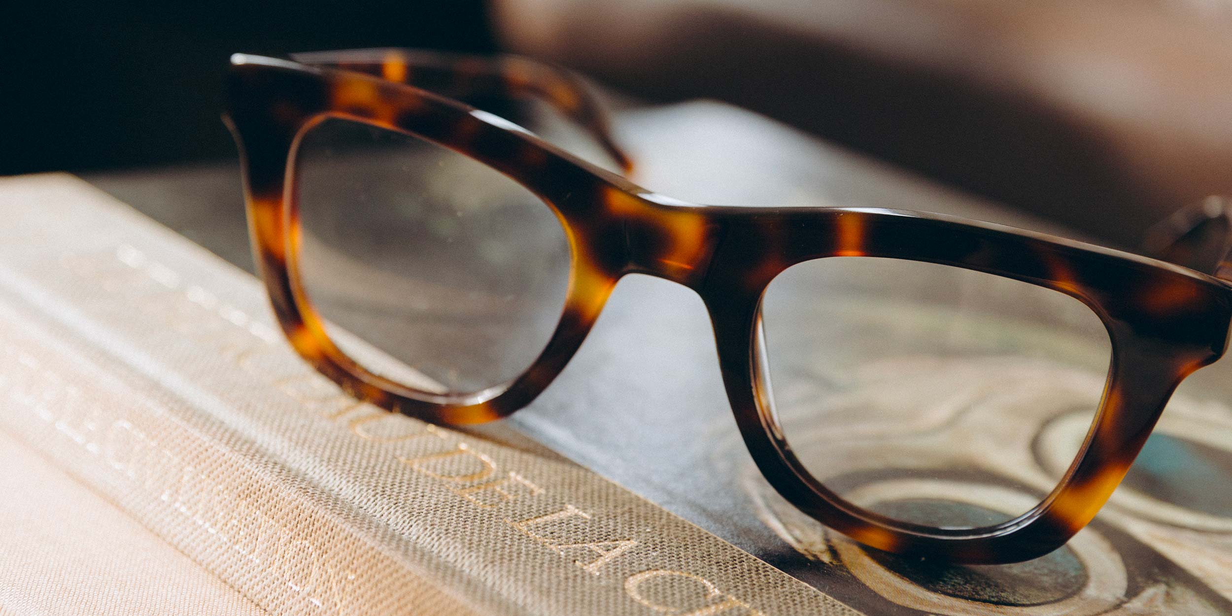 Photo Details of Constance Blue Light Honey Blue Light Glasses in a room