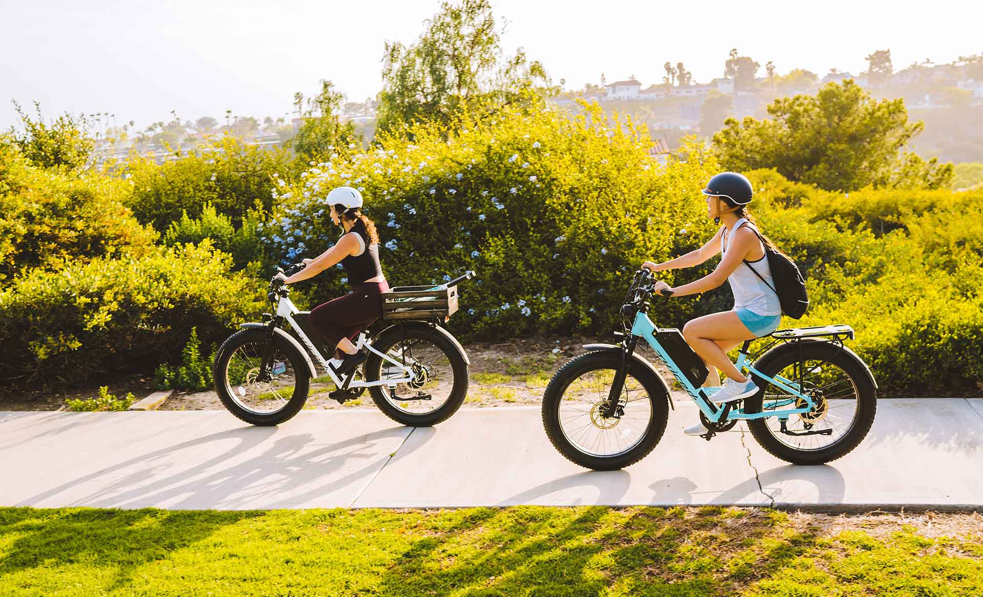 two women riding juiced bikes ripcurrent s
