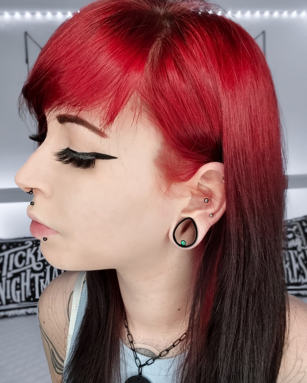 girl wearing small  Blue Opal & Black Steel Teardrop Tunnel / Plug / Gauge