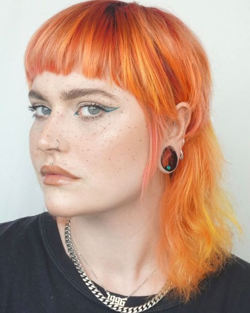 Women wearing big  Blue Opal & Black Steel Teardrop Tunnel / Plug / Gauge
