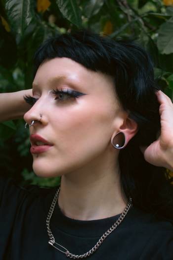 Female wearing cool Silver Opal Teardrop Stainless Steel Ear Tunnel / Plug / Gauge