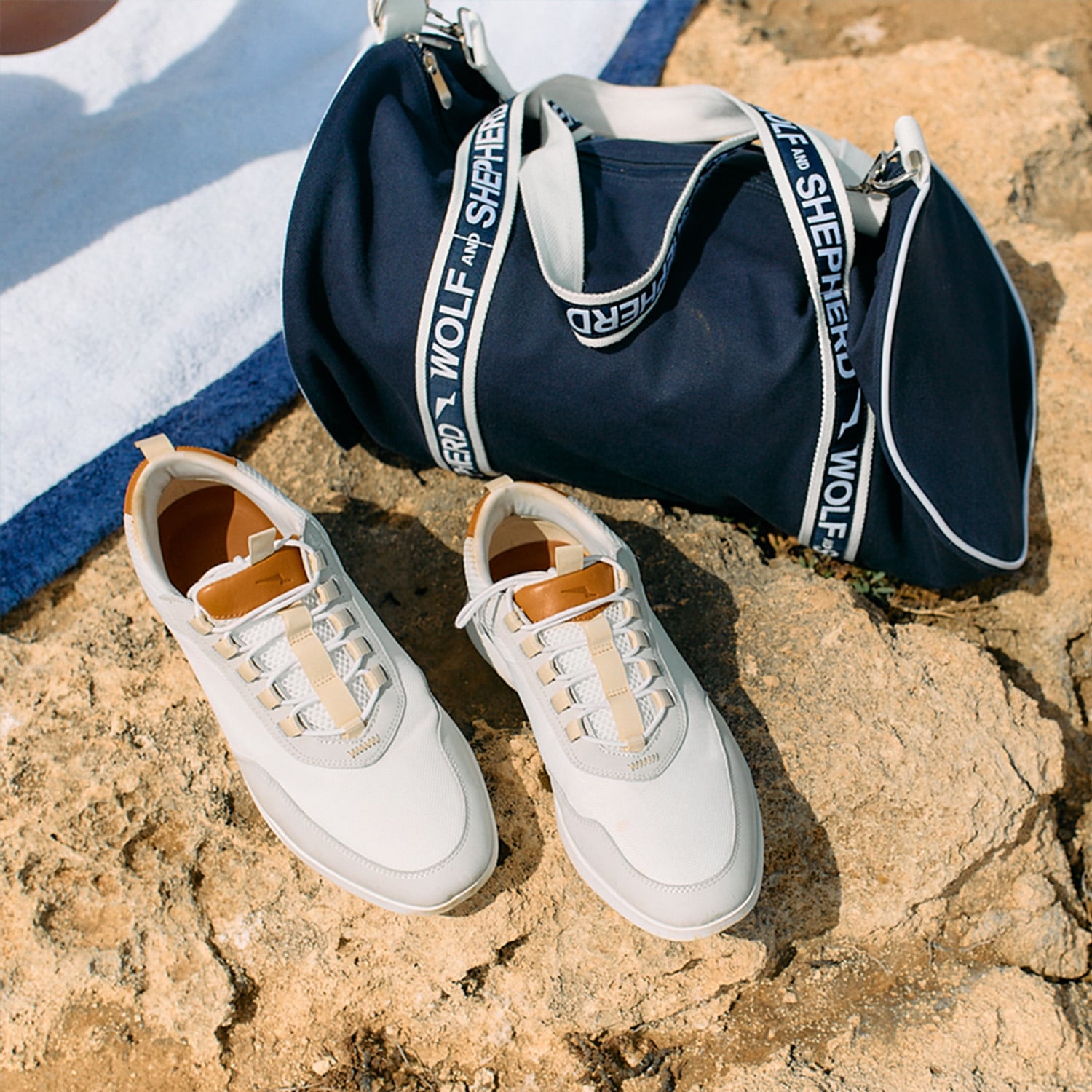 Crossover victory trainer in white on rocks.