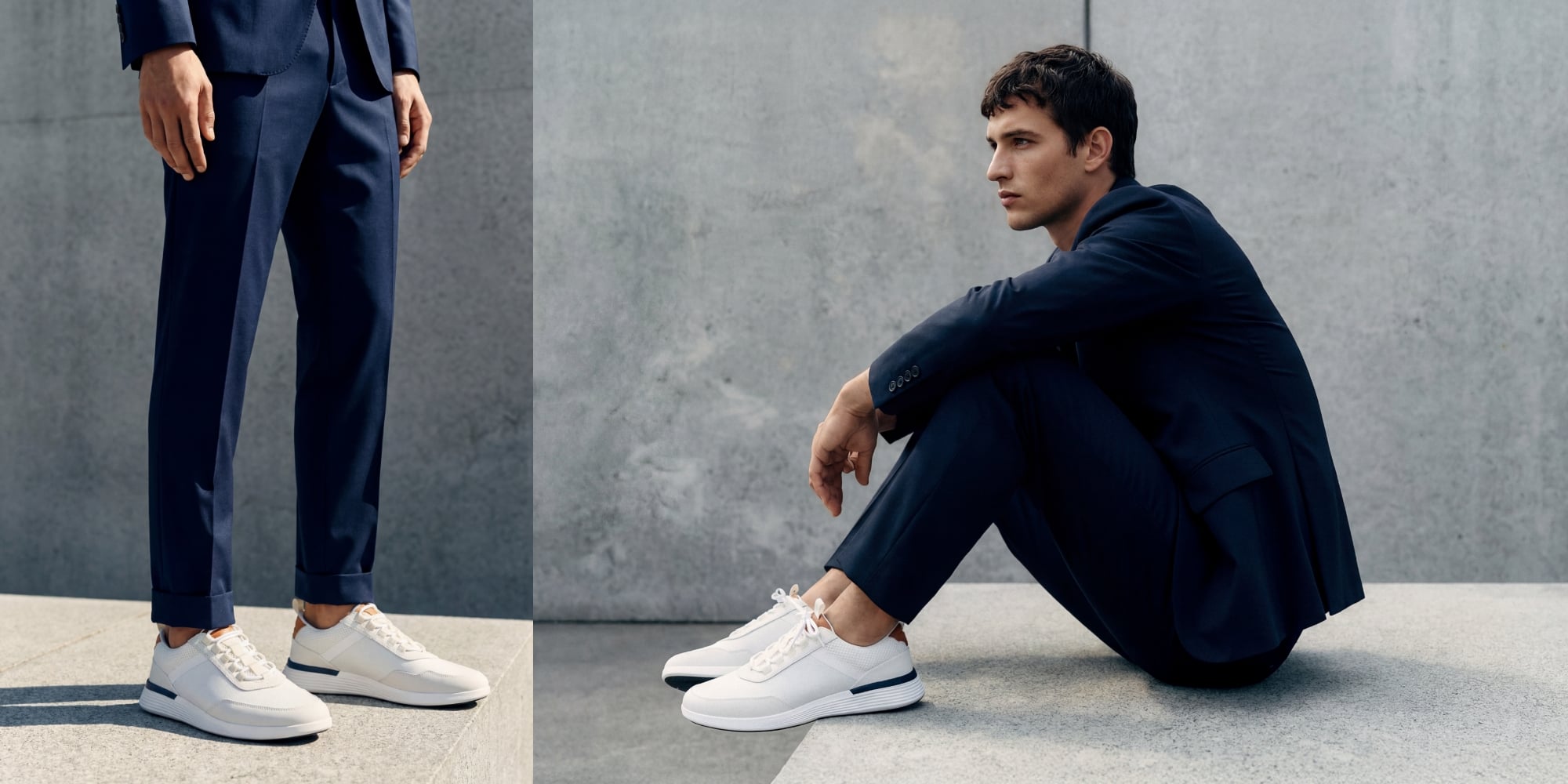 Crossover Victory Trainer in White worn by handsome male in his late 20s wearing sharp navy suit sitting on concrete bench.