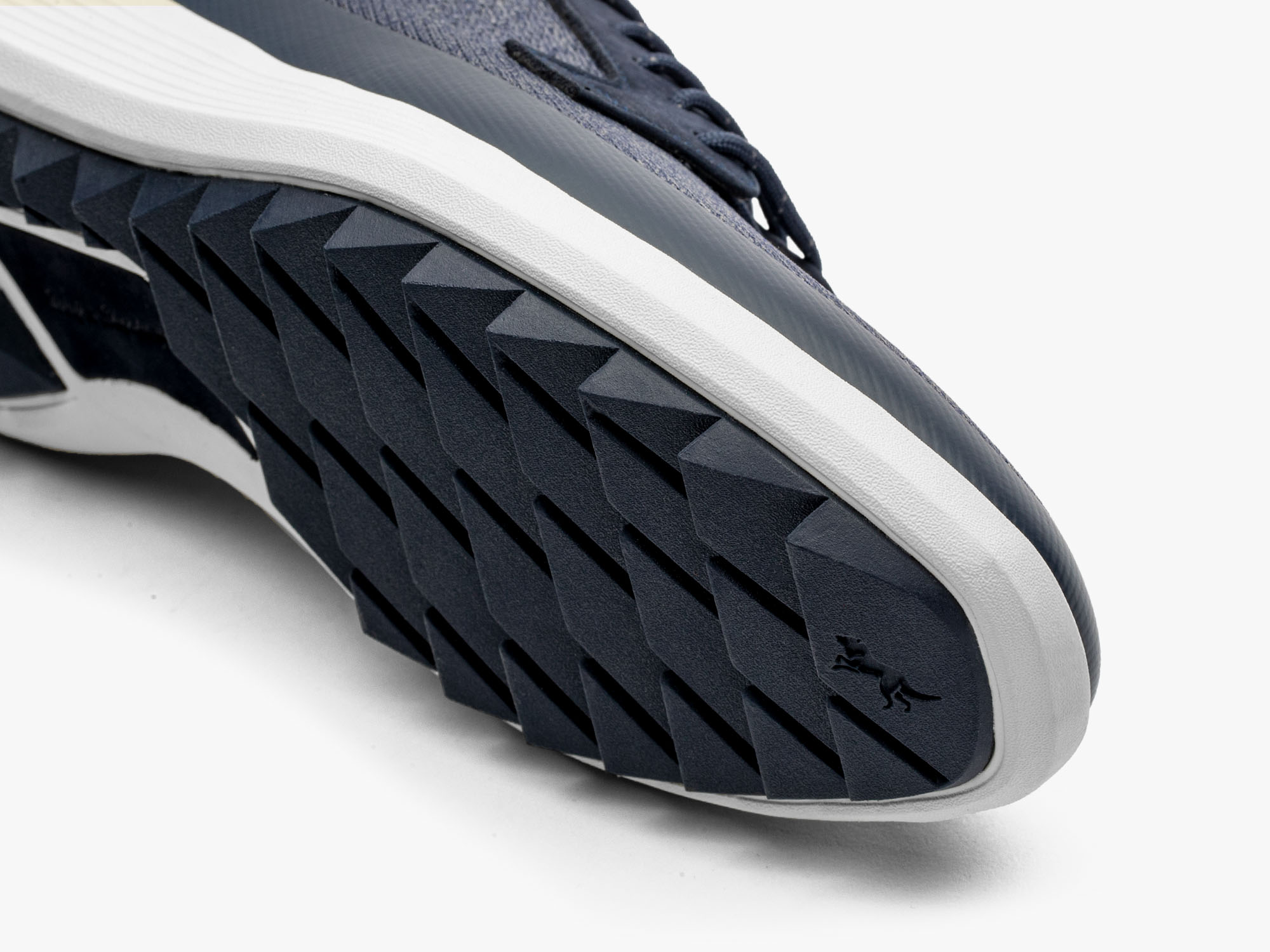 Close up image of toothgrip sole of Men's Hybrid Dress shoe Swiftknit Derby WTZ in Heather Navy on a white background