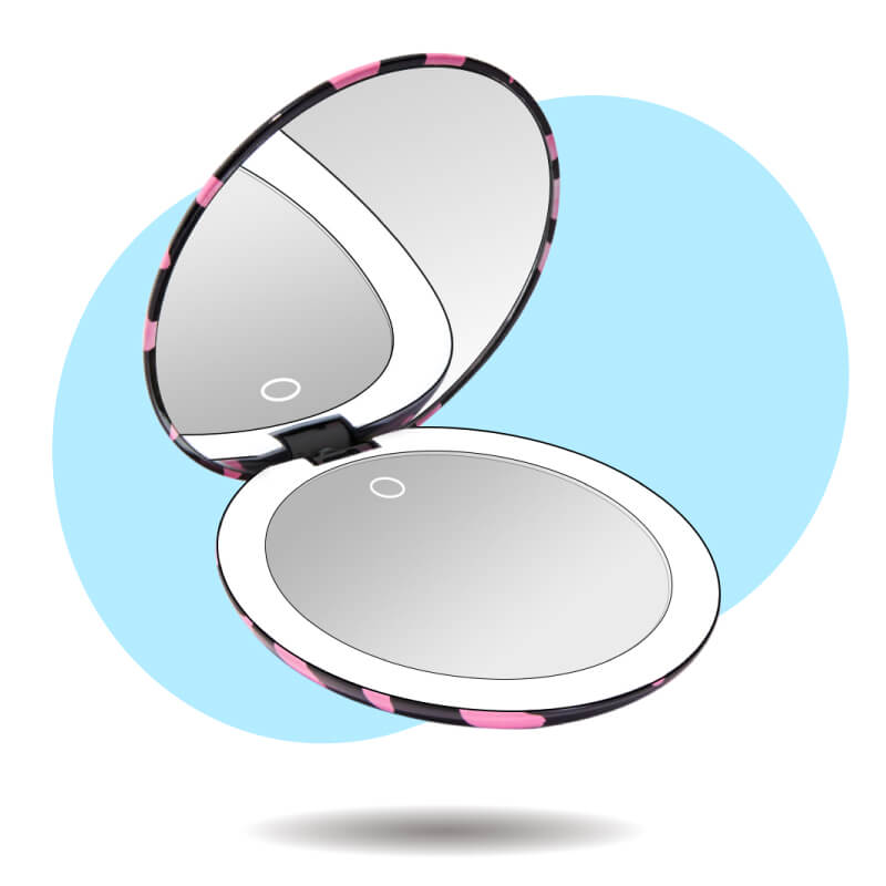 Taylor compact mirror by Fancii in the love train pattern open with 1x and 10x magnifying mirrors
