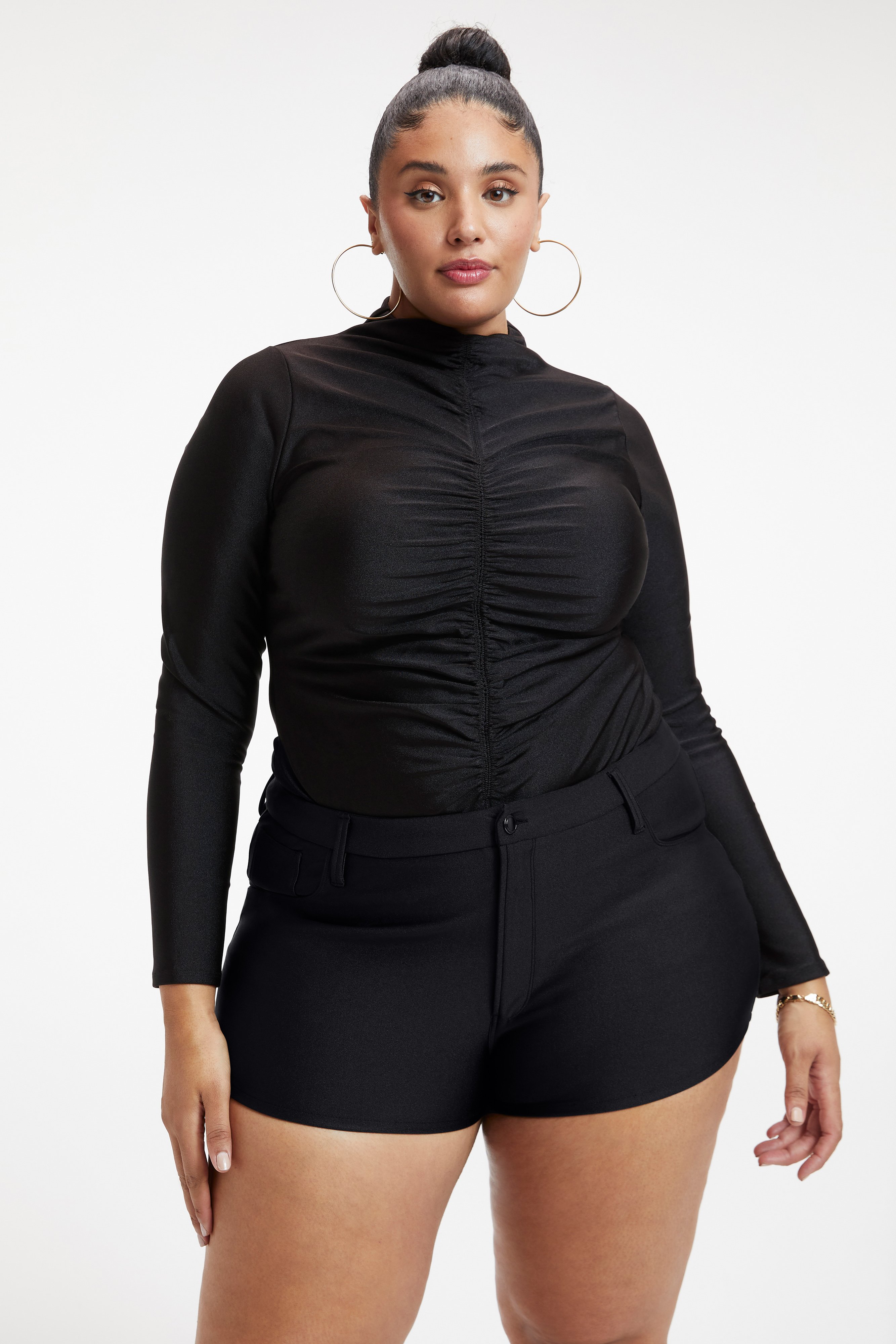 HIGH SHINE COMPRESSION RUCHED BODYSUIT in BLACK001 styled with our HIGH SHINE COMPRESSION HOT SHORT in BLACK001, HIGH SHINE COMPRESSION GOOD WAIST LEGGINGS in BLACK001, or SHINE COMPRESSION GOOD WAIST STRAIGHT in BLACK001