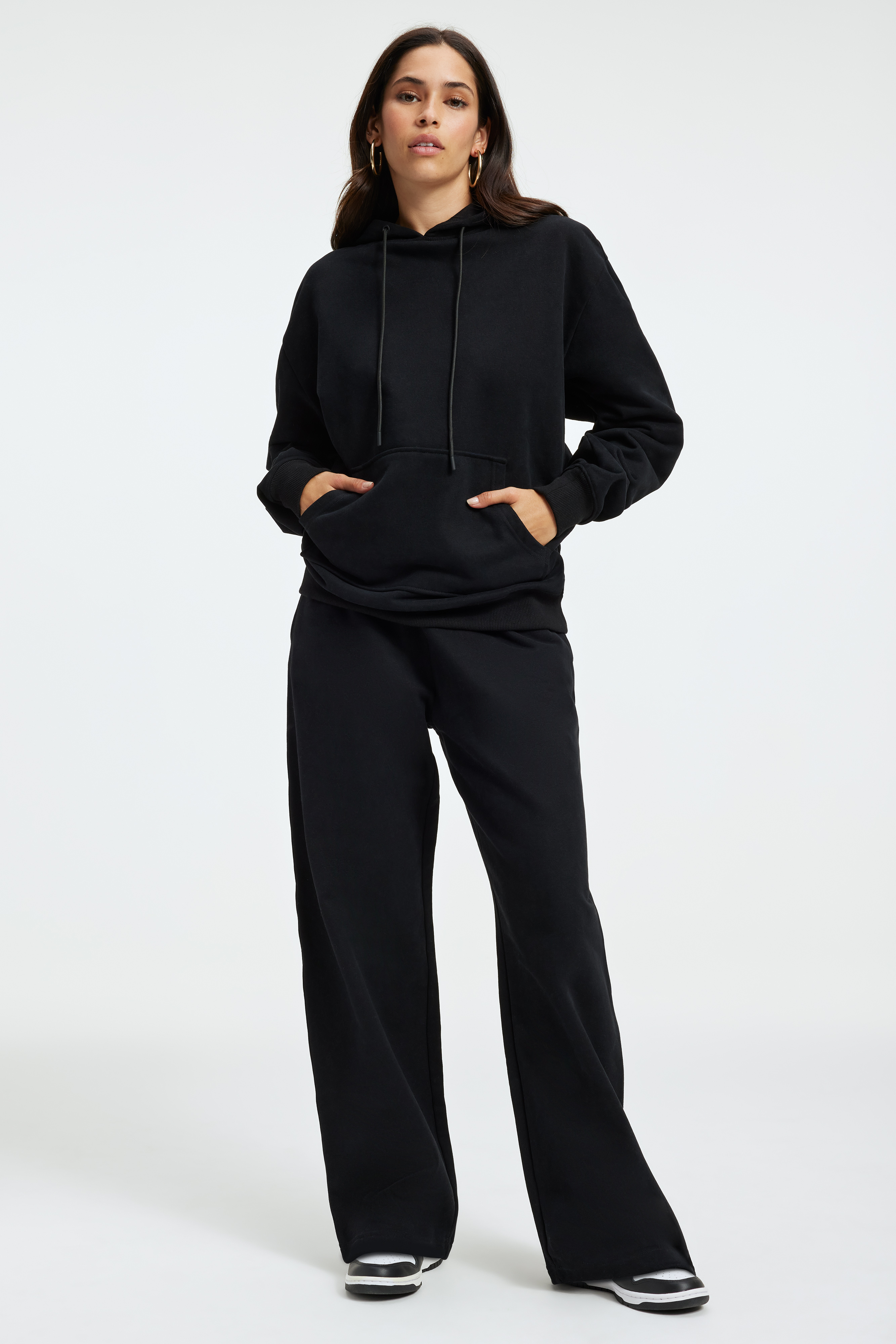 SUEDED FLEECE BOYFRIEND HOODIE in BLACK001 styled with our SUEDED FLEECE EXTRA WIDE LEG in BLACK001, or FLARE LEGGINGS in BLACK001