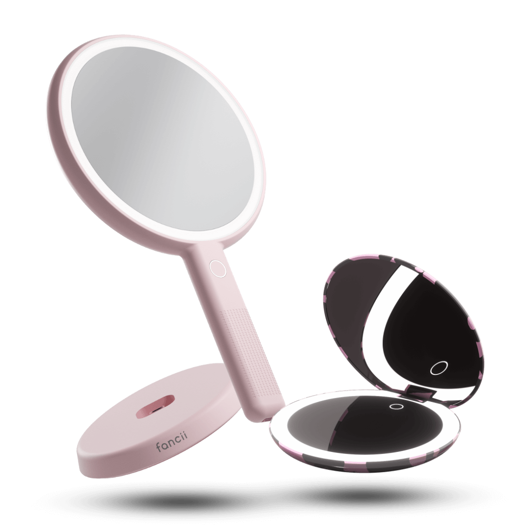 Taylor compact mirror by Fancii in the love train pattern open with 1x and 10x magnifying mirrors