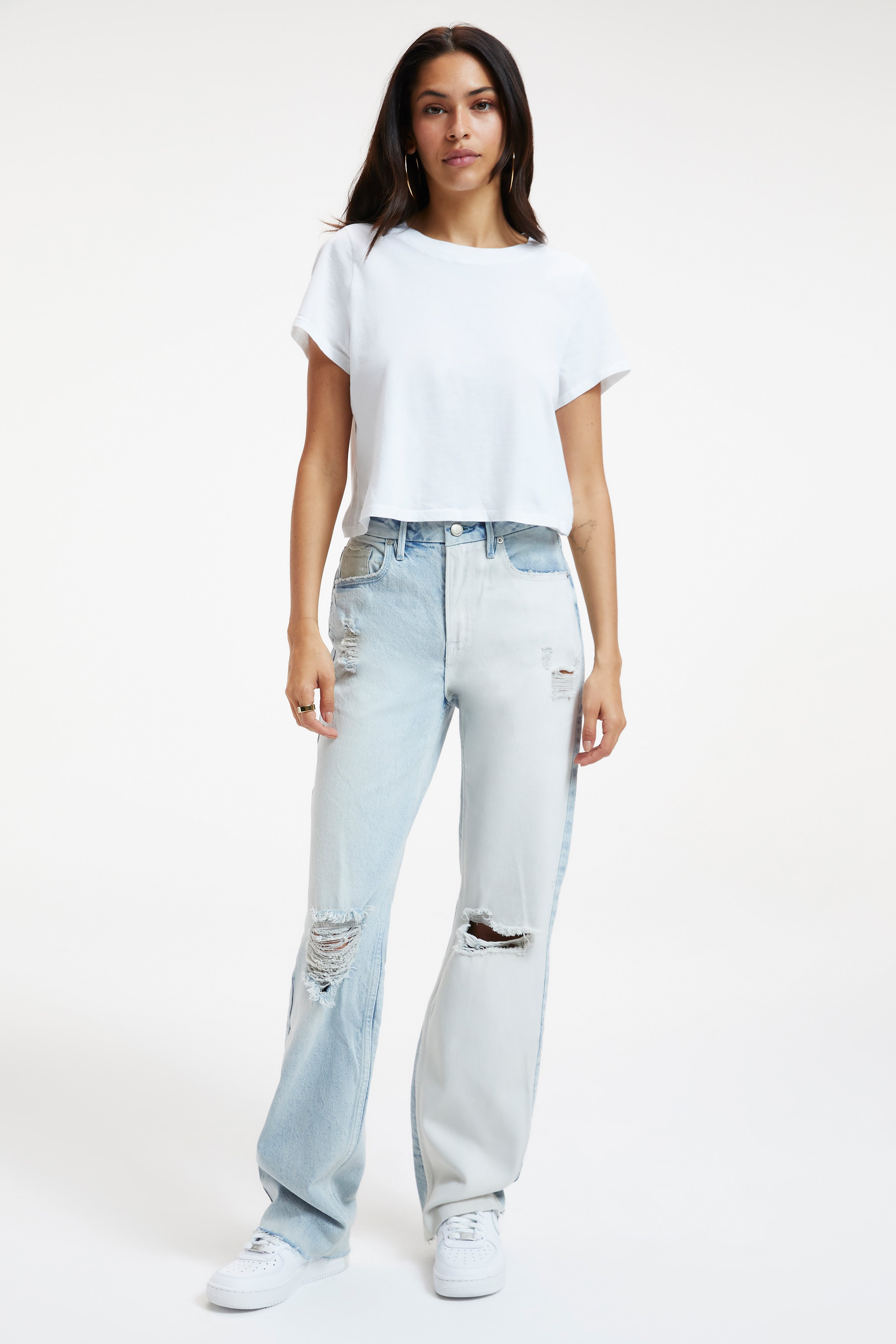 GOOD '90S PIECED JEANS in INDIGO359 styled with our COTTON CROPPED TEE in WHITE001, COTTON CROPPED LONG SLEEVE TEE in WHITE001, or RIB FITTED TEE BODYSUIT in WHITE001