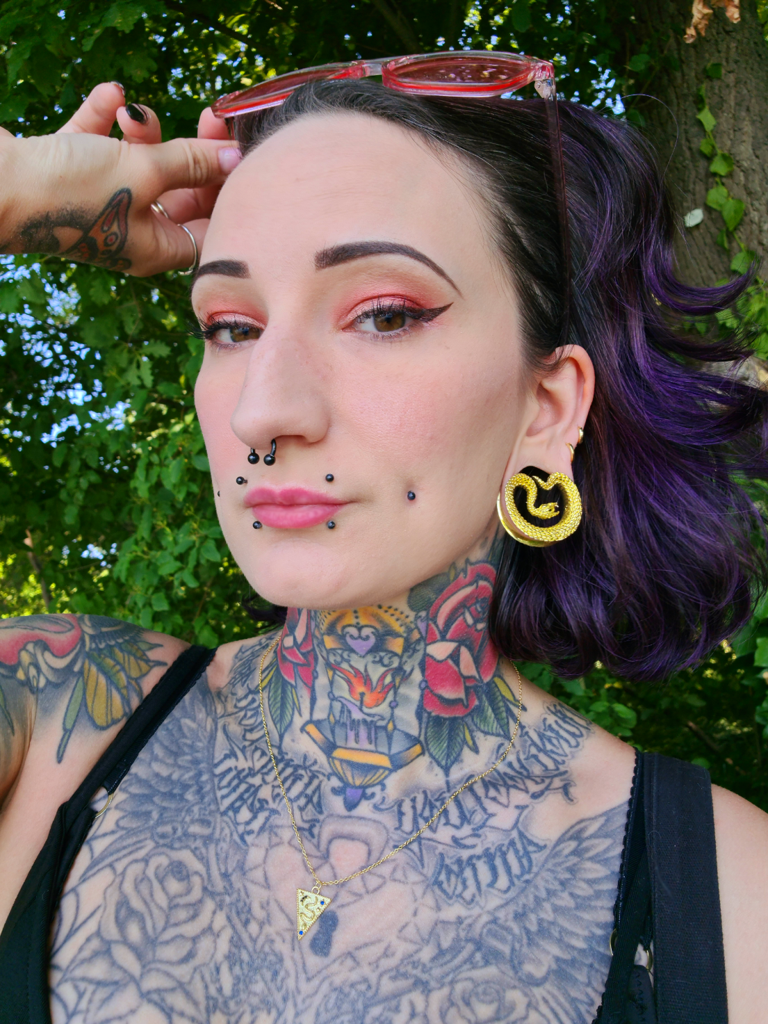 female wearing cute  Gold Snake Saddle Metal Ear Gauge / Plug