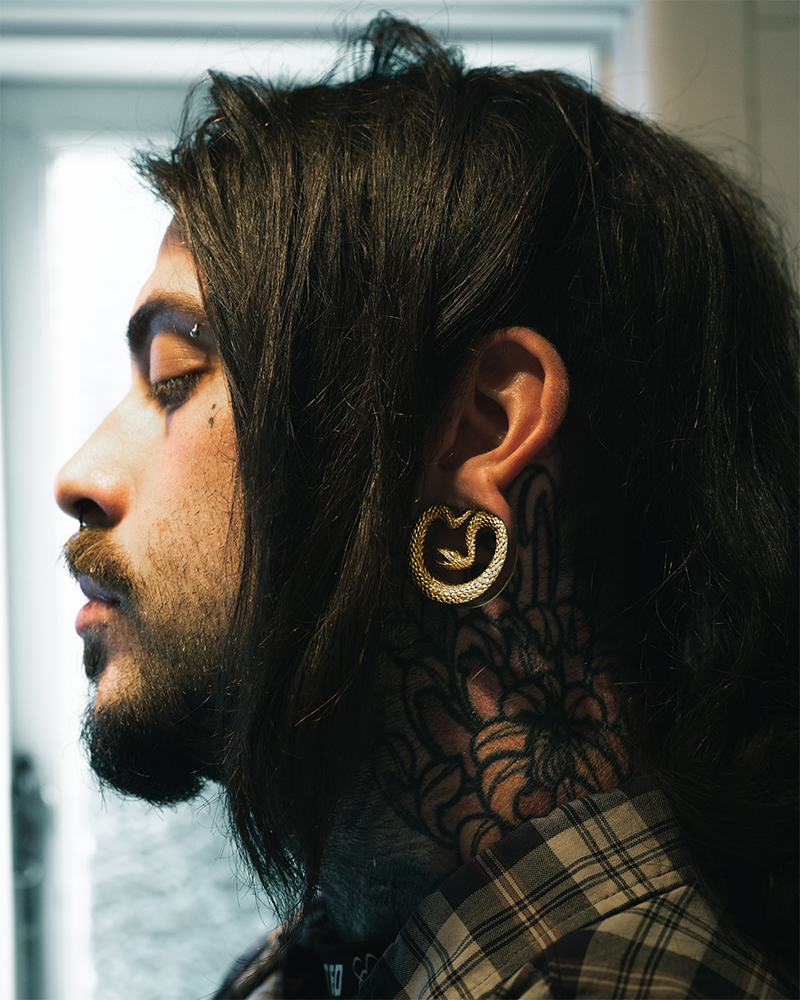 Guy wearing big  Gold Snake Saddle Metal Ear Gauge / Plug
