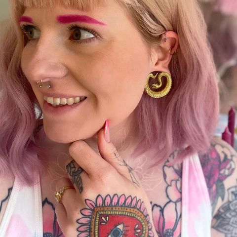 girl wearing pretty  Gold Snake Saddle Metal Ear Gauge / Plug