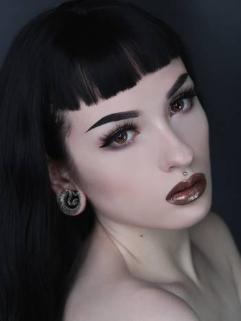 Women wearing large Silver Snake Brass Saddle Ear Plug / Gauge