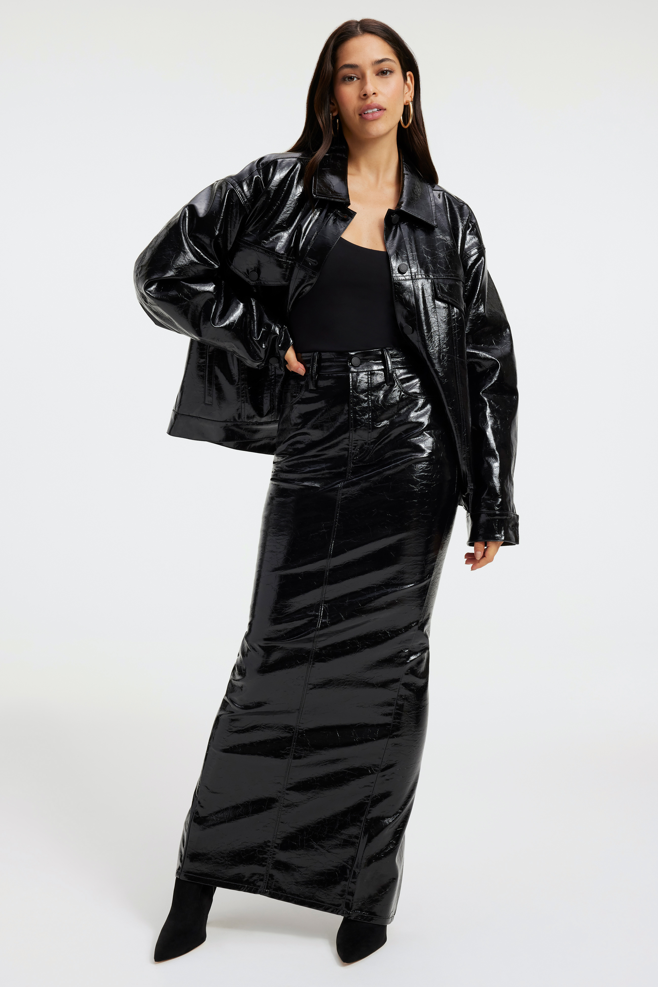 SCOOP NECK BODYSUIT in BLACK001 styled with our FAUX LEATHER MAXI SKIRT in BLACK001, FAUX LEATHER TRUCKER JACKET in BLACK001, or VINYL LEGGINGS in BLACK001