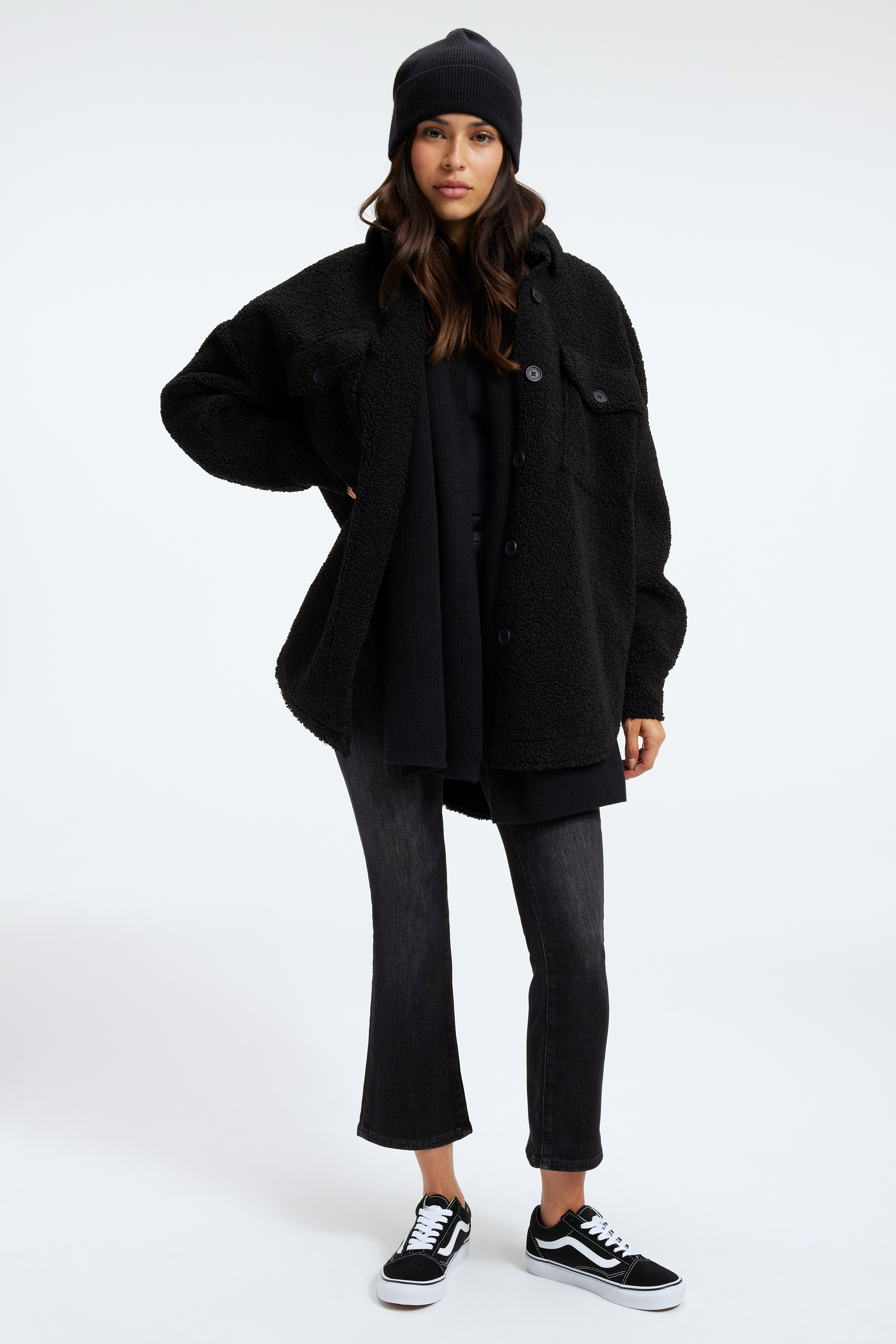 GOOD KNIT BEANIE in BLACK001 styled with our SCULPTED BODYSUIT in BLACK001, SHERPA SHACKET in BLACK001, or GOOD CLASSIC BOOTCUT JEANS in BLACK162