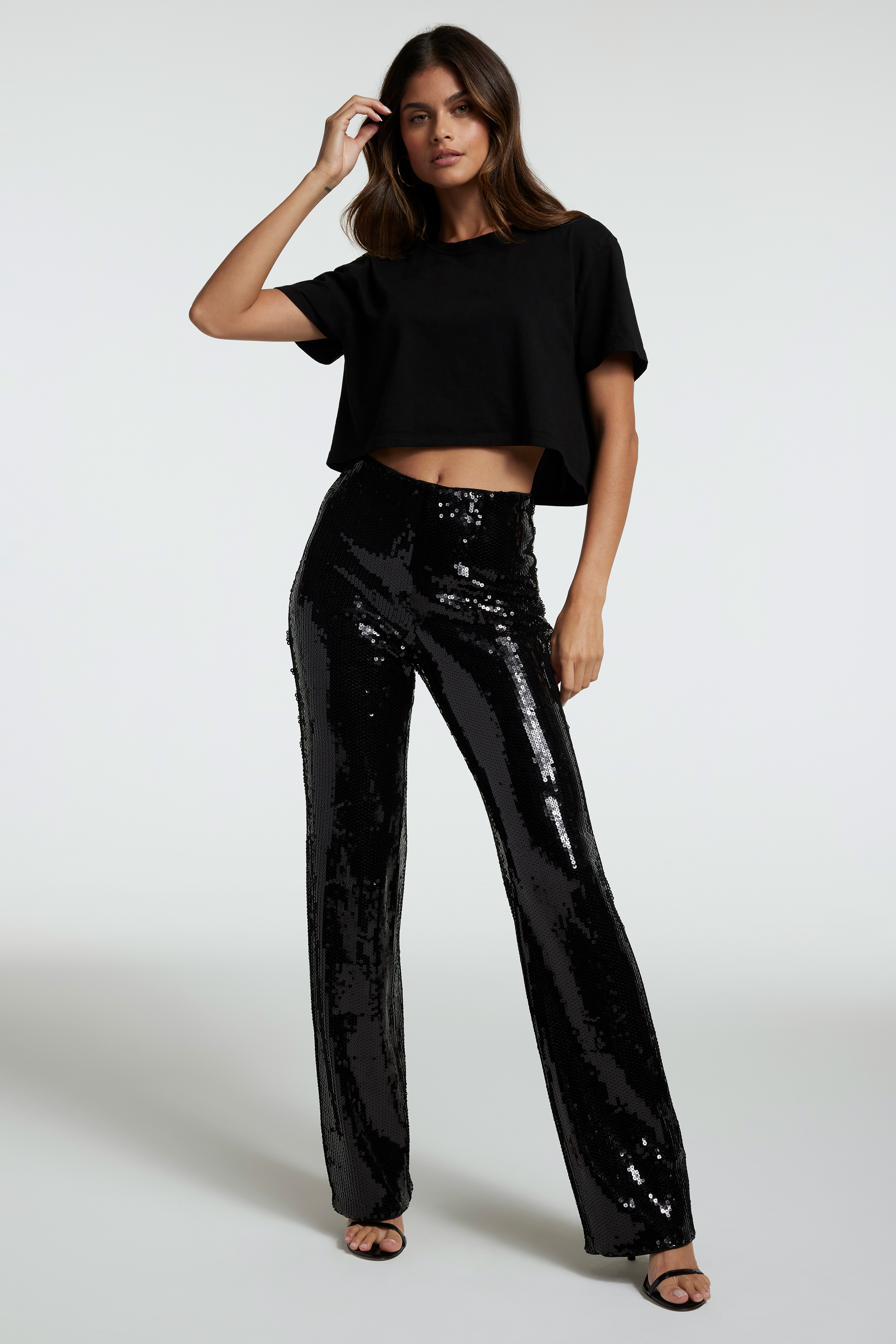 SEQUIN PARTY PANT in BLACK001 styled with our COTTON CROPPED TEE in BLACK001, SEQUIN PARTY TEE in BLACK001, or SEQUIN PARTY SHIRT in BLACK001