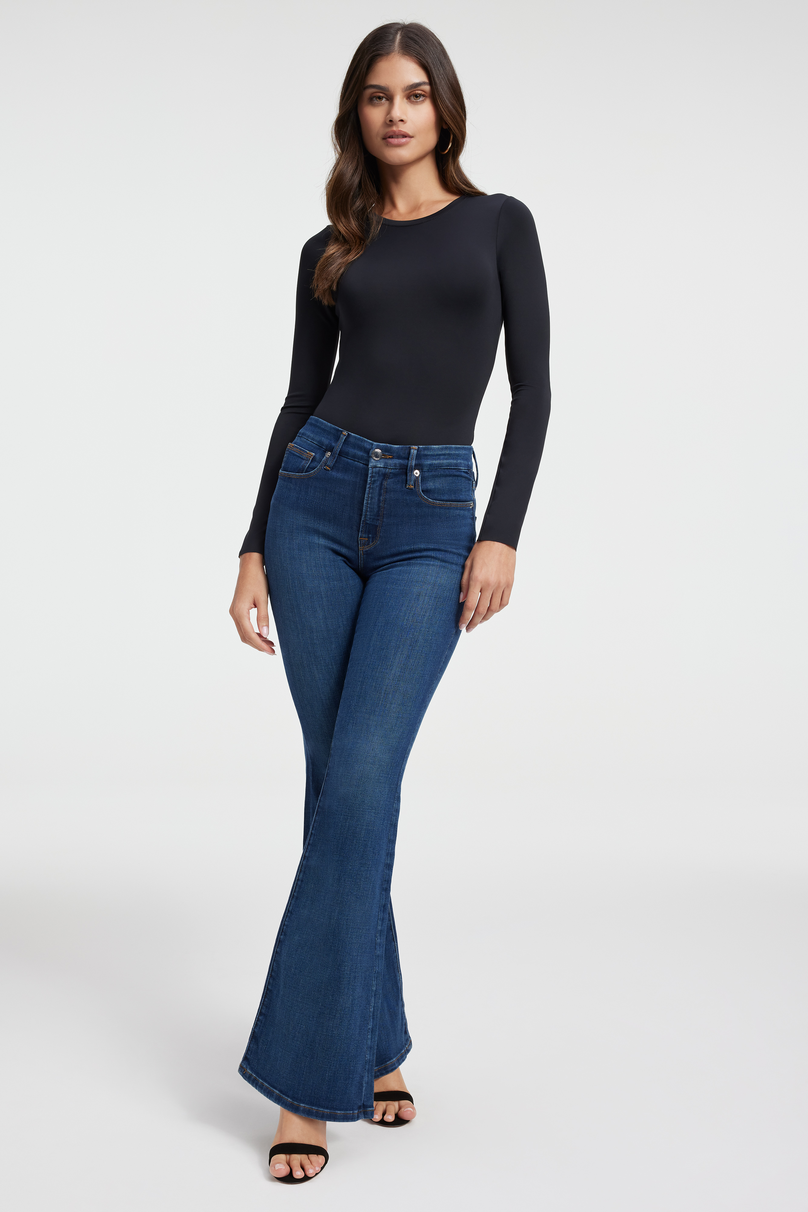 GOOD LEGS FLARE JEANS in BLUE004 styled with our SCUBA CREW BODYSUIT in BLACK001, SCUBA CROP MOCK NECK in BLACK001, or SCUBA CROP TEE in BLACK001