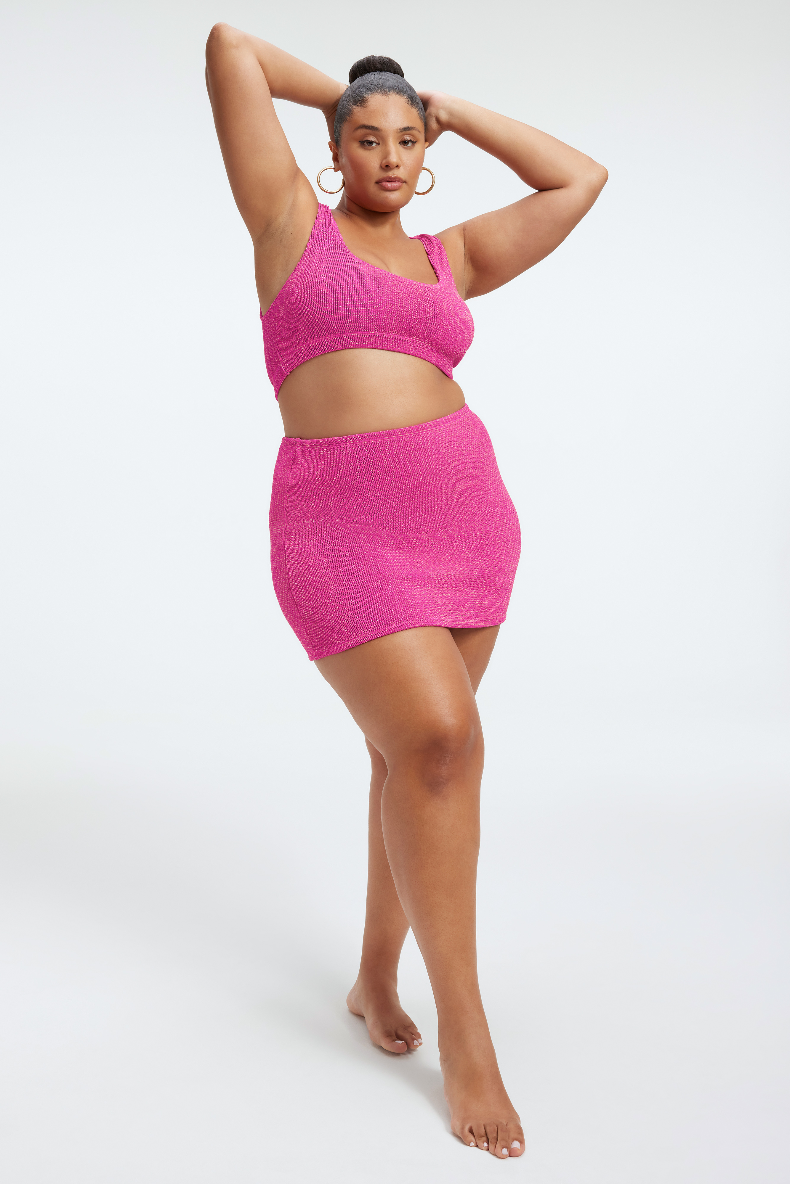 ALWAYS FITS METALLIC MINI SKIRT in FUSCHIA PINK001 styled with our ALWAYS FITS METALLIC SCOOP TOP in FUSCHIA PINK001, ALWAYS FITS METALLIC TWIST TOP in FUSCHIA PINK001, or ALWAYS FITS TINY METALLIC TOP in FUSCHIA PINK001