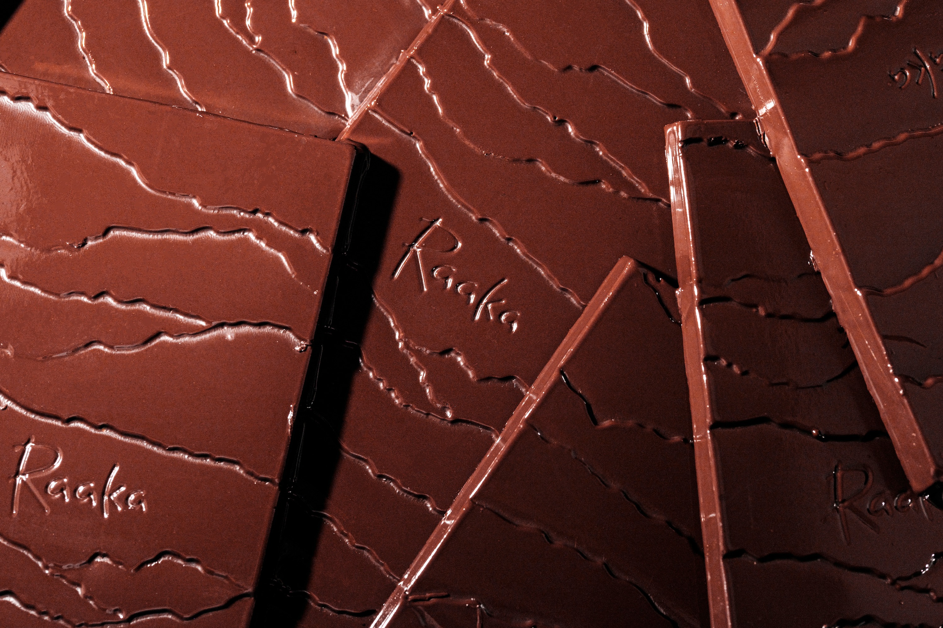 Close up of Raaka dark chocolate bars.