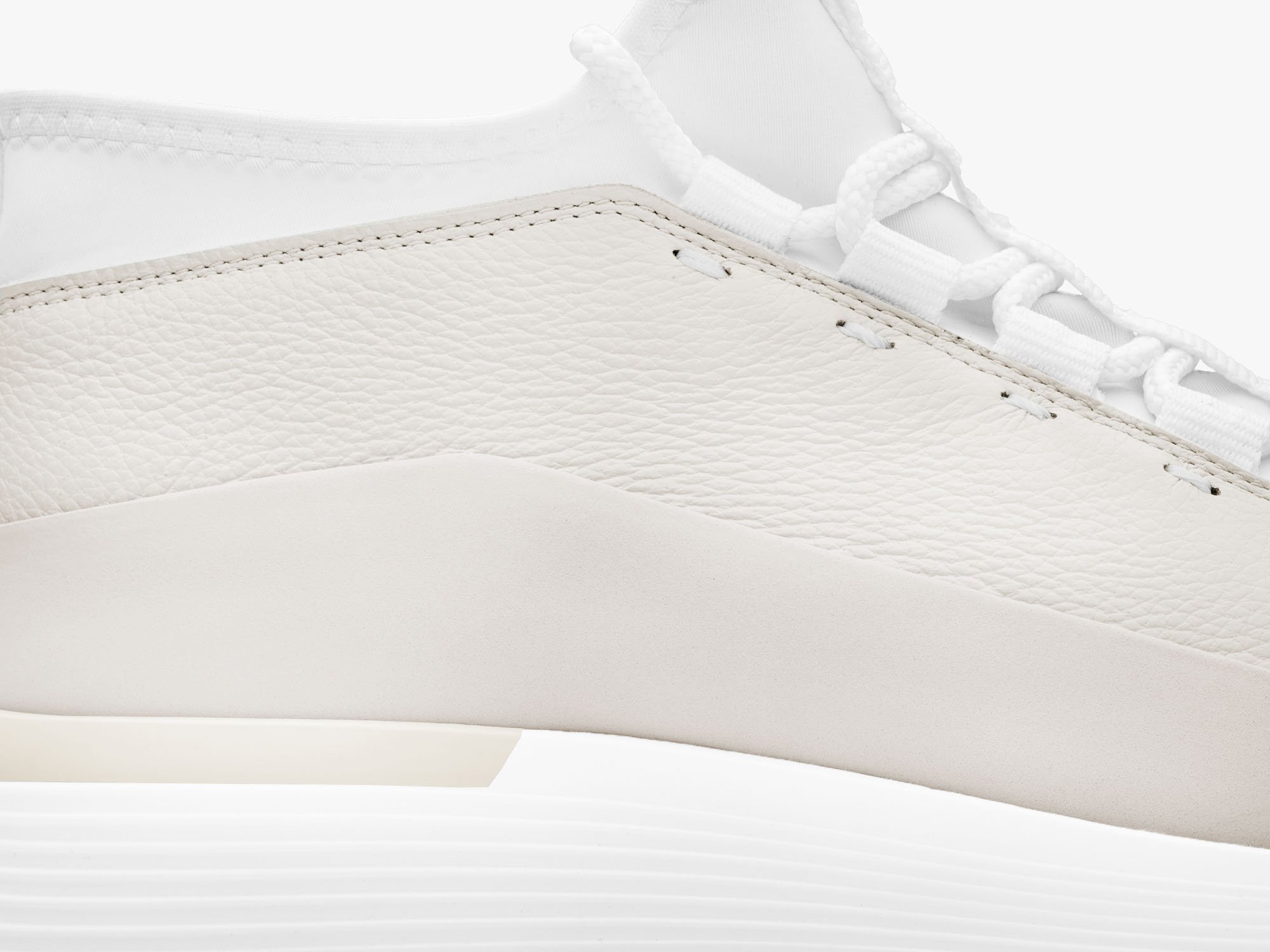 Close up of crossover mid hybrid dress shoe in white