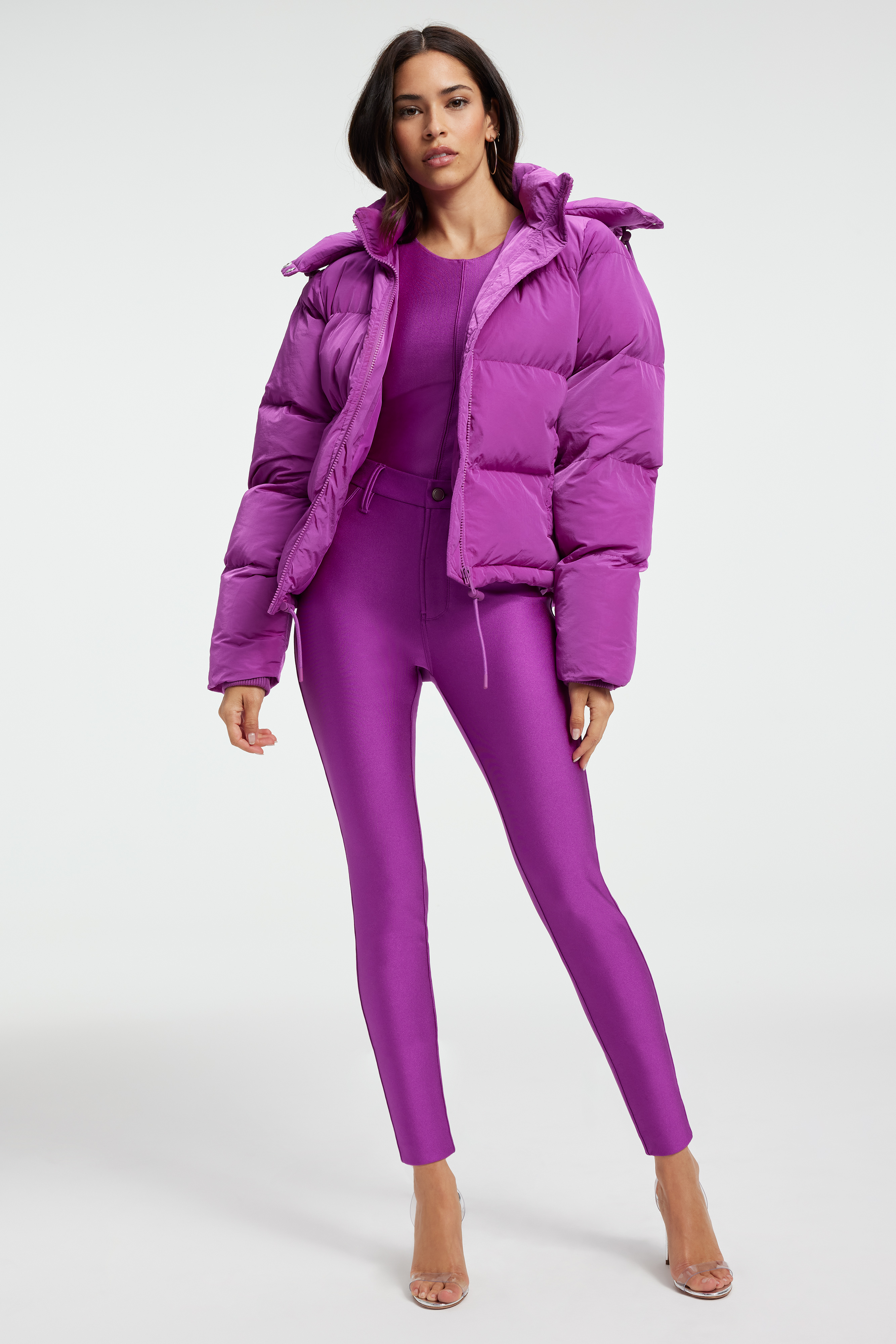 IRIDESCENT PUFFER in POWER PURPLE styled with our COMPRESSION SHINE LEGGINGS in POWER PURPLE, HIGH SHINE COMPRESSION BODYSUIT in POWER PURPLE, or GOOD KNIT BEANIE in POWER PURPLE