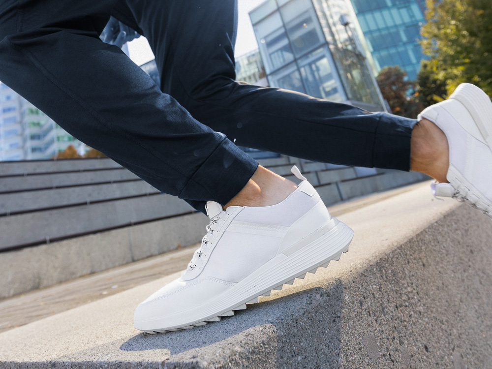 Man running wearing Men's Crossover Trainer WTZ Hybrid Dress Shoe in White