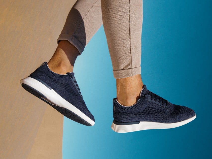 Ankle down view of a man wearing supremeknit trainer in navy