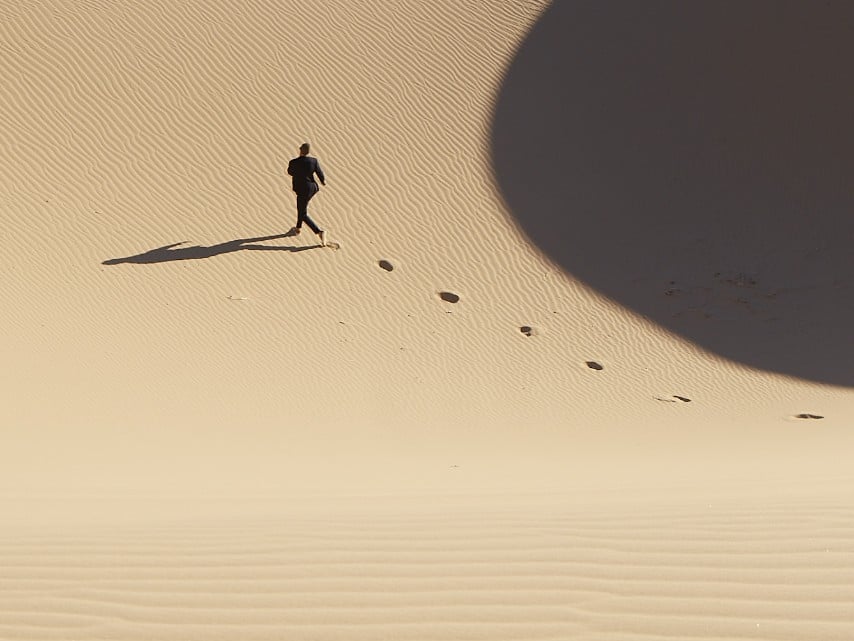 Far away view of man running