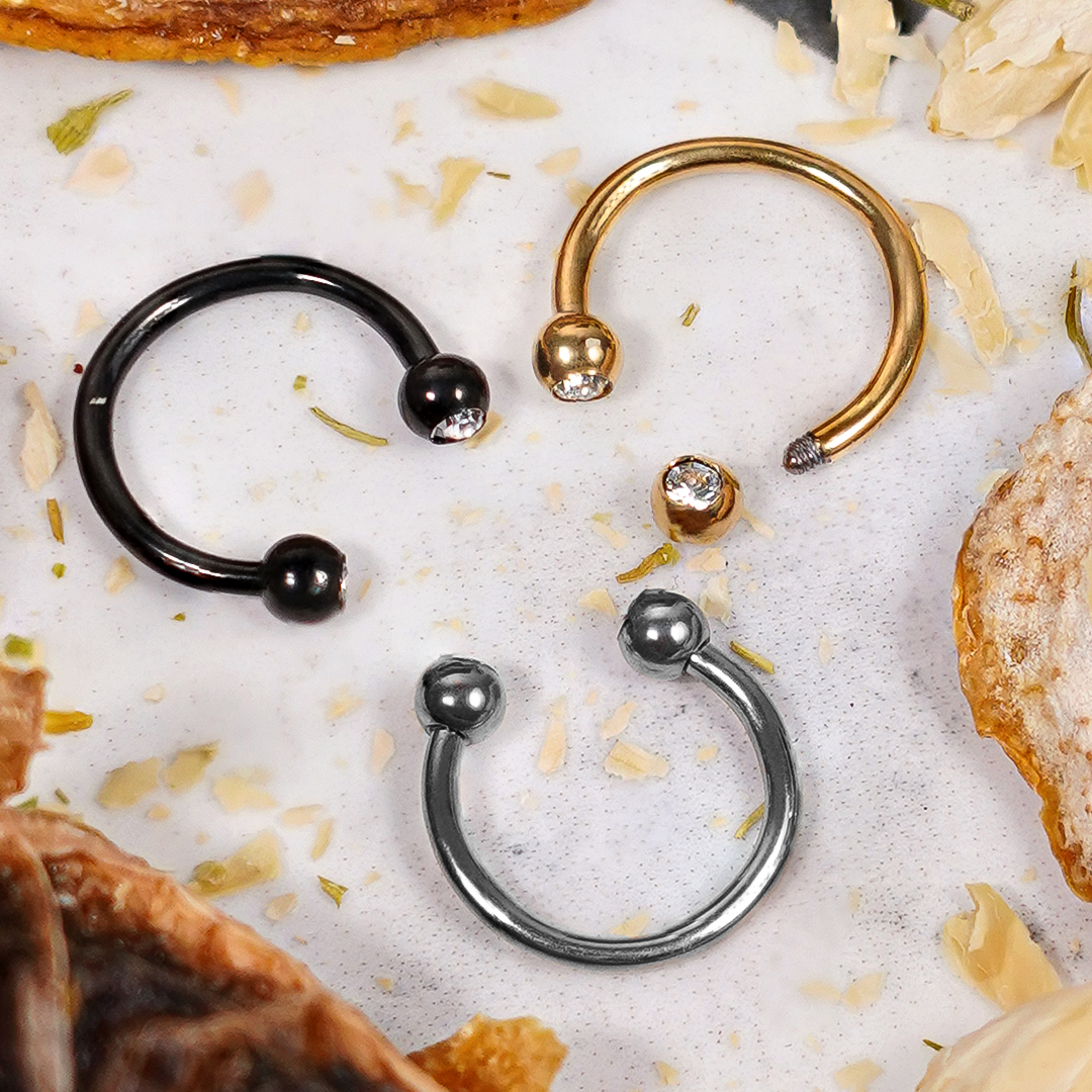 Titanium Curved Barbell 1.2mm with Clear Gems Titanium Externally Threaded Circular Barbell 1.2mm Gauge in Gold with Clear Gems