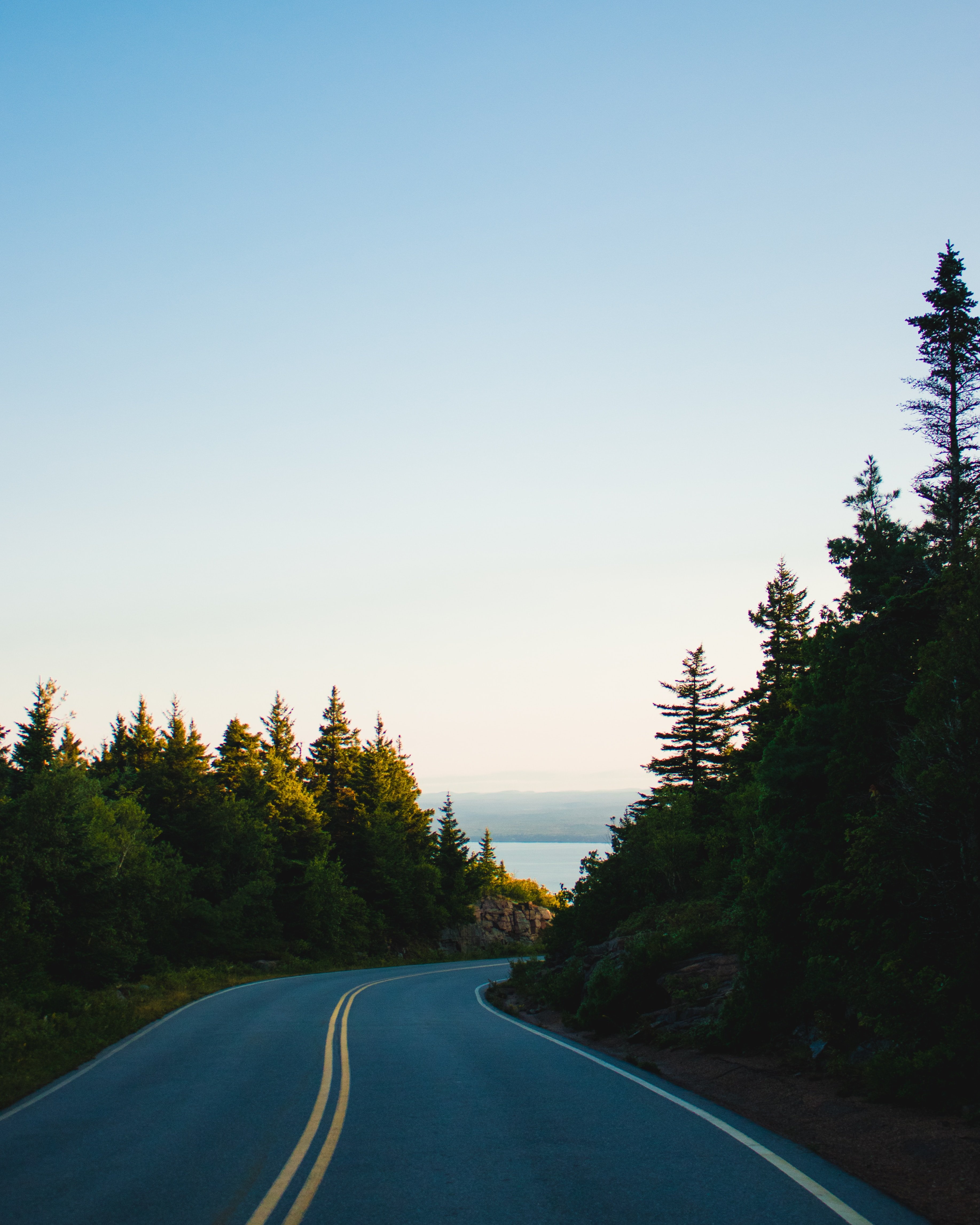 photo of a long coastal road