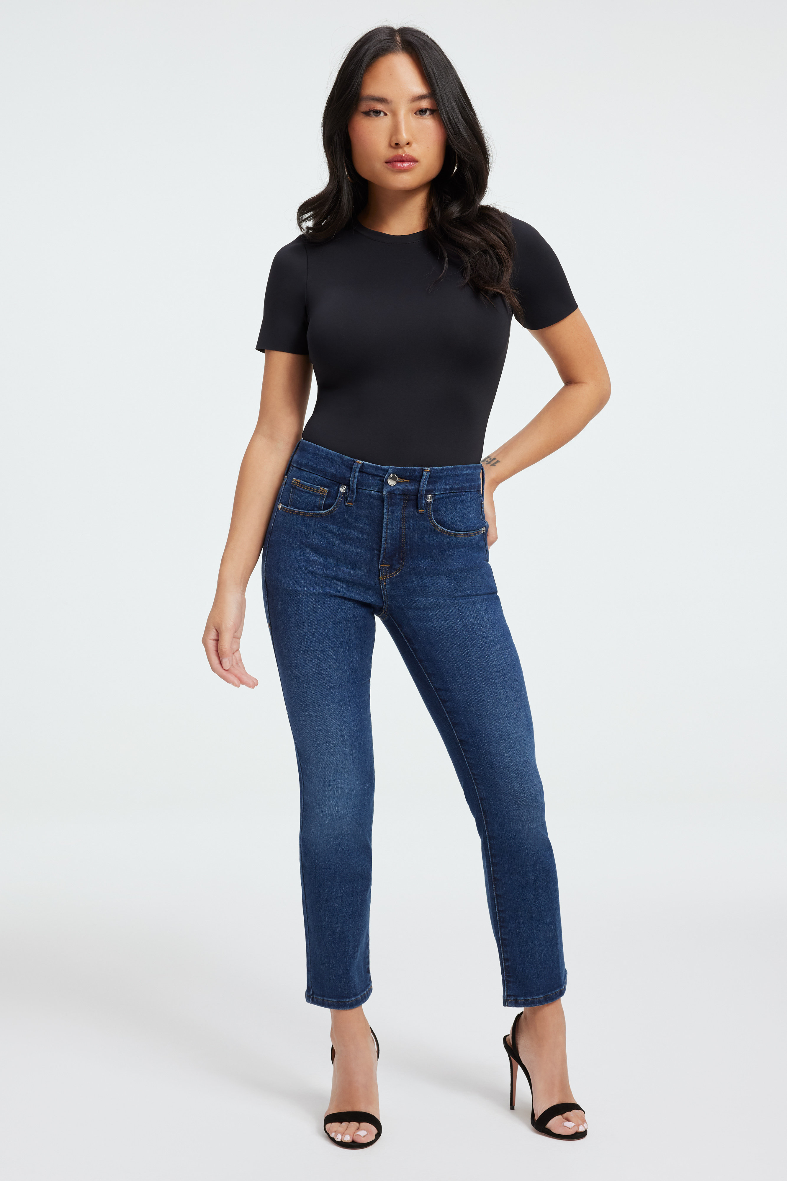 GOOD PETITE STRAIGHT in BLUE004 styled with our FAUX LEATHER MODERN TANK BODYSUIT in BLACK001, COMPRESSION SHINE BODYSUIT in BLACK001, or RACERBACK TANK BODYSUIT in BLACK001
