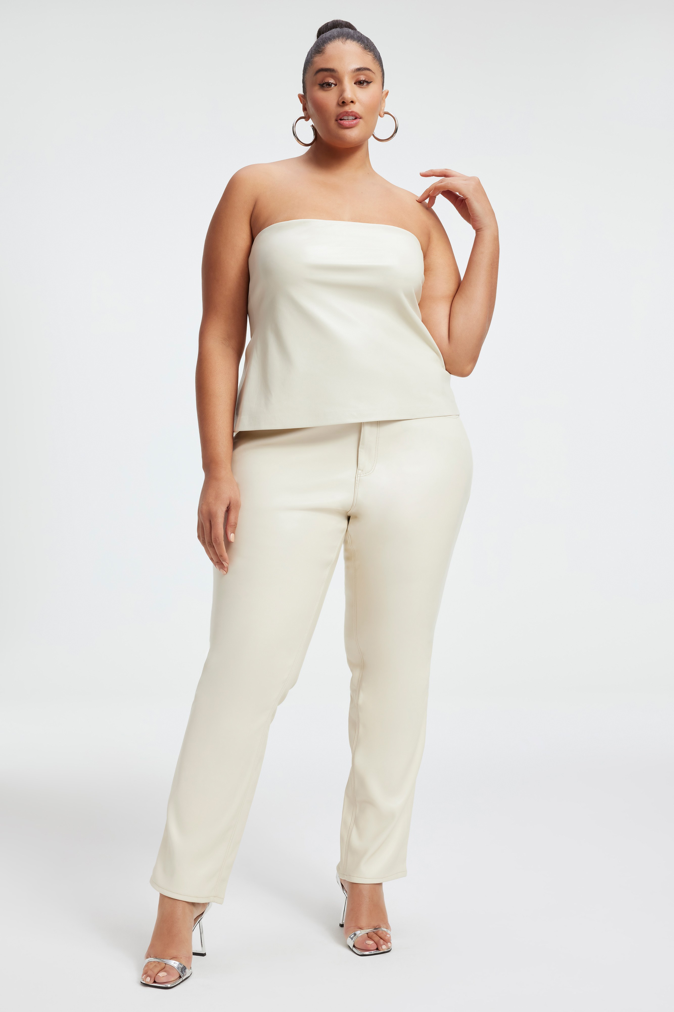 FAUX LEATHER TUBE TOP in BONE001 styled with our GOOD ICON FAUX LEATHER PANTS in BONE001, GOOD LEGS CROPPED MINI BOOT FAUX LEATHER PANTS in BONE001, or GOOD PETITE SKINNY JEANS in INDIGO312