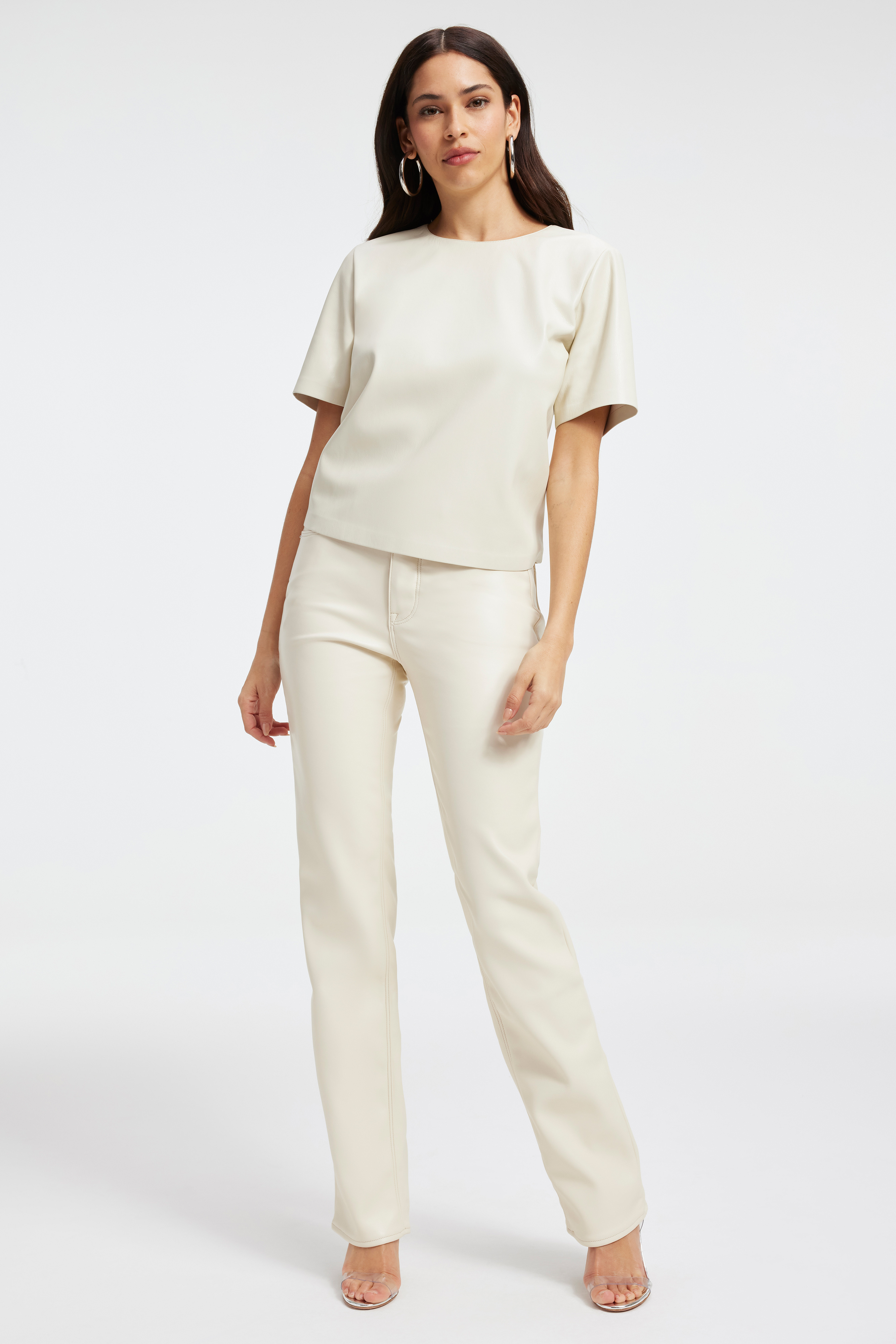 FAUX LEATHER TEE in BONE001 styled with our GOOD ICON FAUX LEATHER PANTS in BONE001, GOOD LEGS CROPPED MINI BOOT FAUX LEATHER PANTS in BONE001, or GOOD '90S in BLUE541