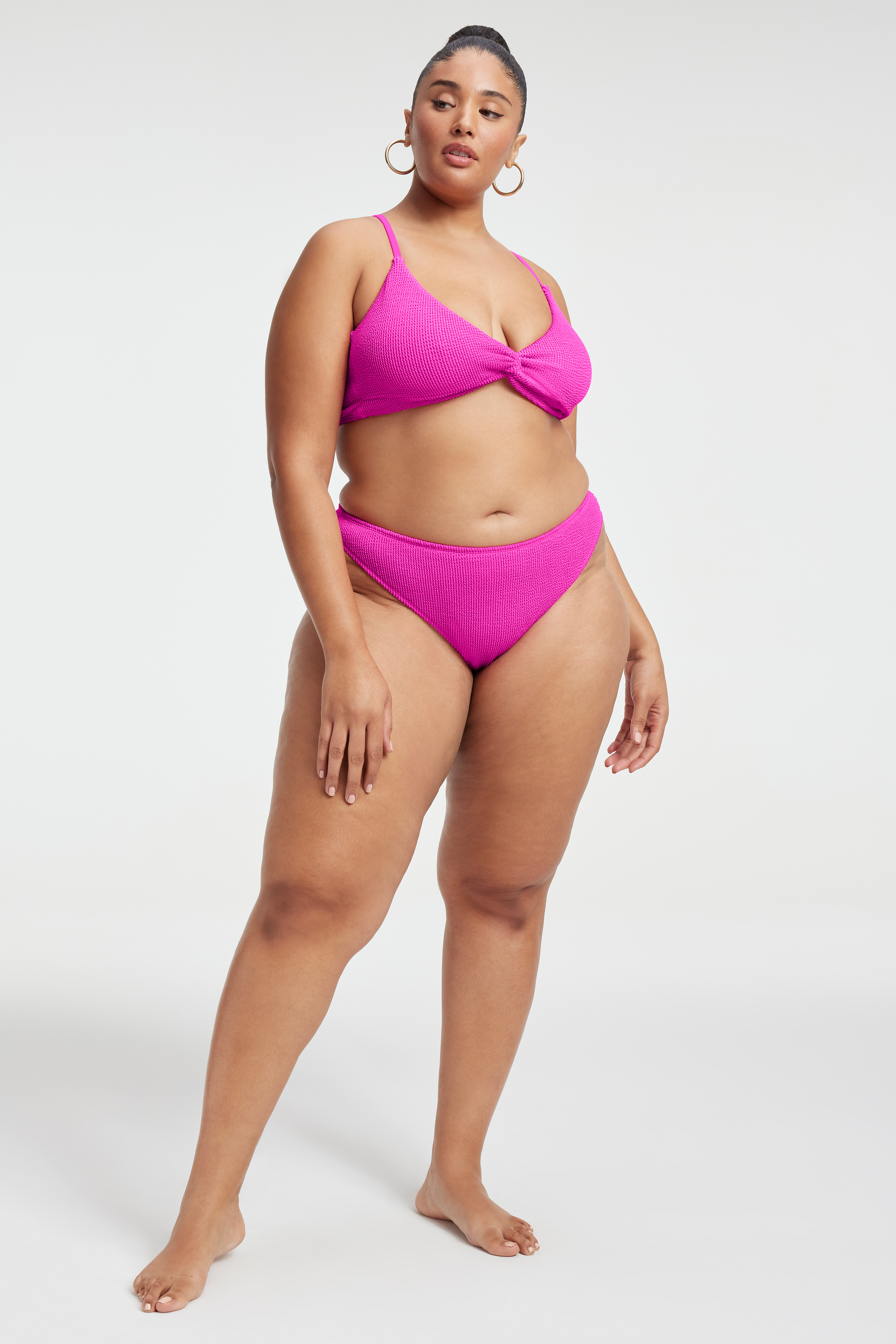 ALWAYS FITS TWIST BIKINI TOP in HAWAIIAN PINK001 styled with our ALWAYS FITS BETTER BIKINI BOTTOM in HAWAIIAN PINK001, ALWAYS FITS MINI SKIRT in HAWAIIAN PINK001, or ALWAYS FITS PLISSÉ PANTS in FUCHSIA PINK001