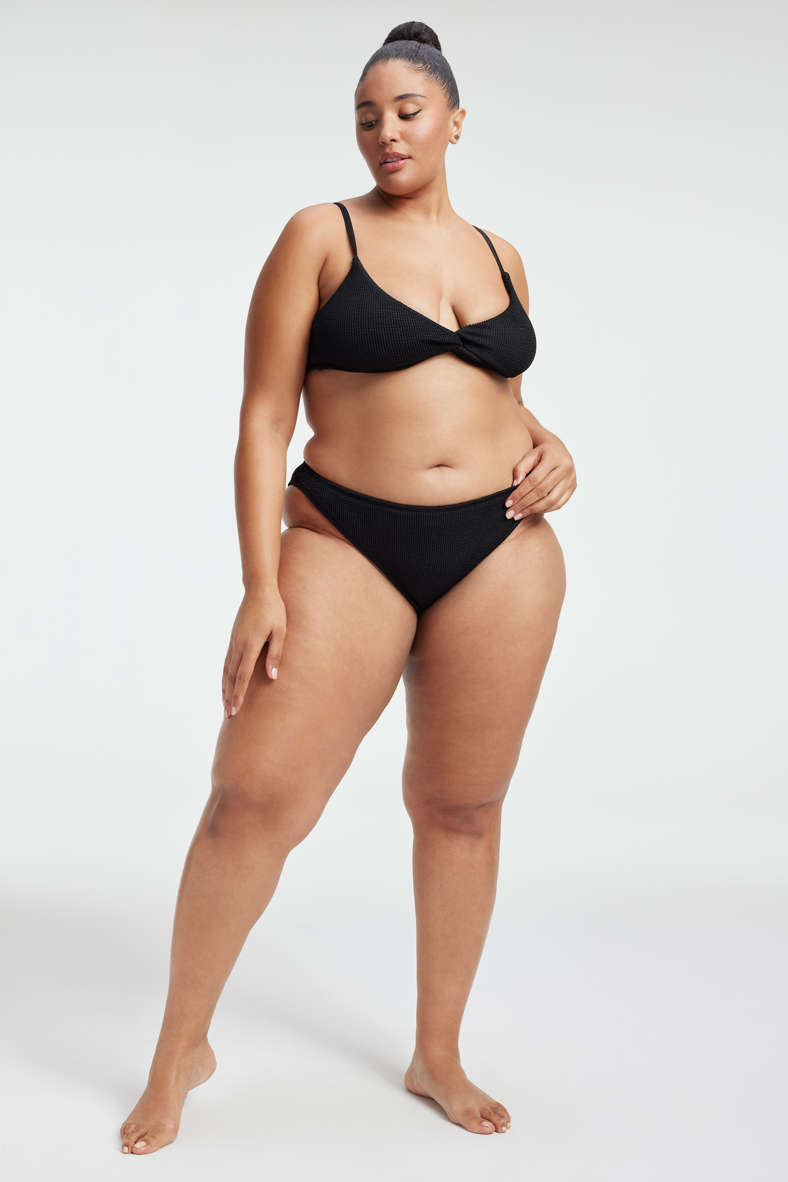 ALWAYS FITS TWIST BIKINI TOP in BLACK001 styled with our ALWAYS FITS BOY SHORTS in BLACK001, BETTER BIKINI BOTTOM in BLACK001, or ALWAYS FITS MINI SKIRT in BLACK001