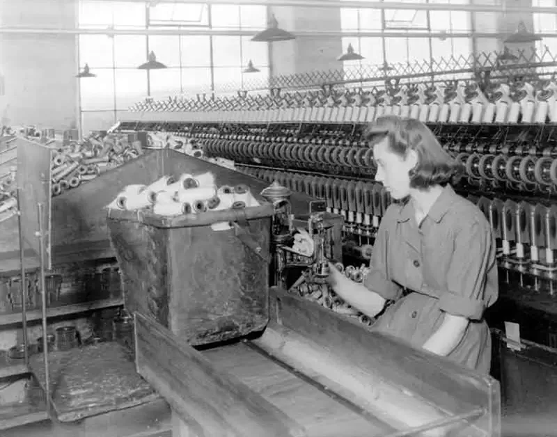 A woman working with cotton threads at the Phoenox Textiles mill in the 1950s.