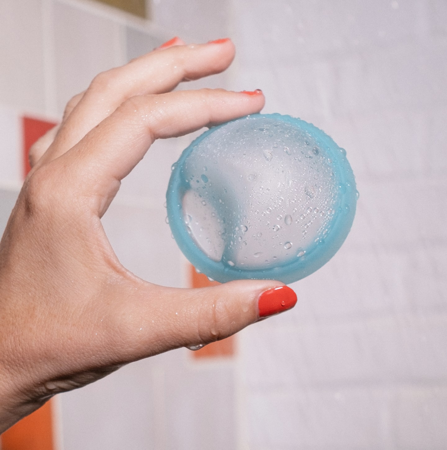 A hand holding a soft fit disc