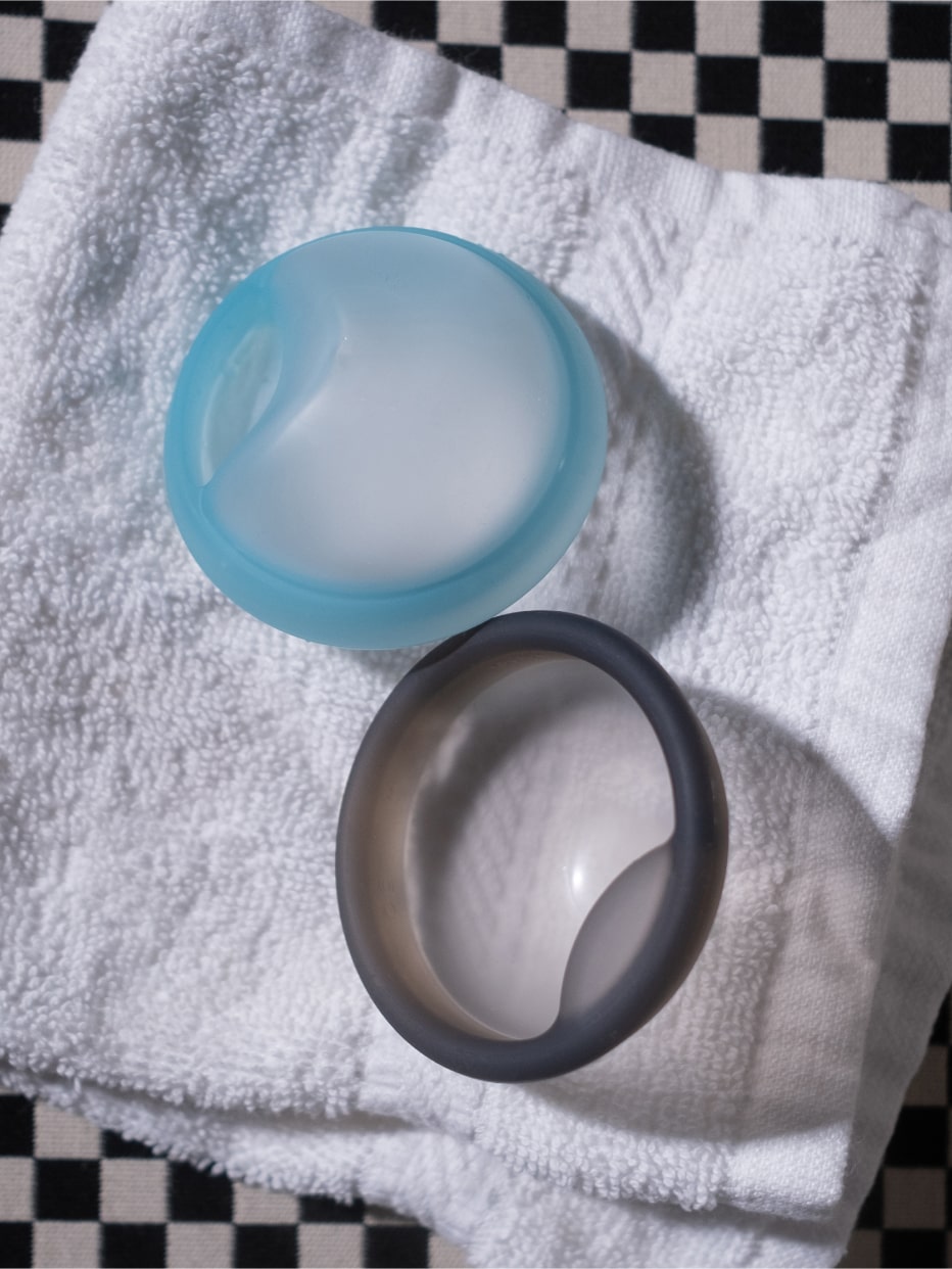 Two soft fit discs sitting on a towel