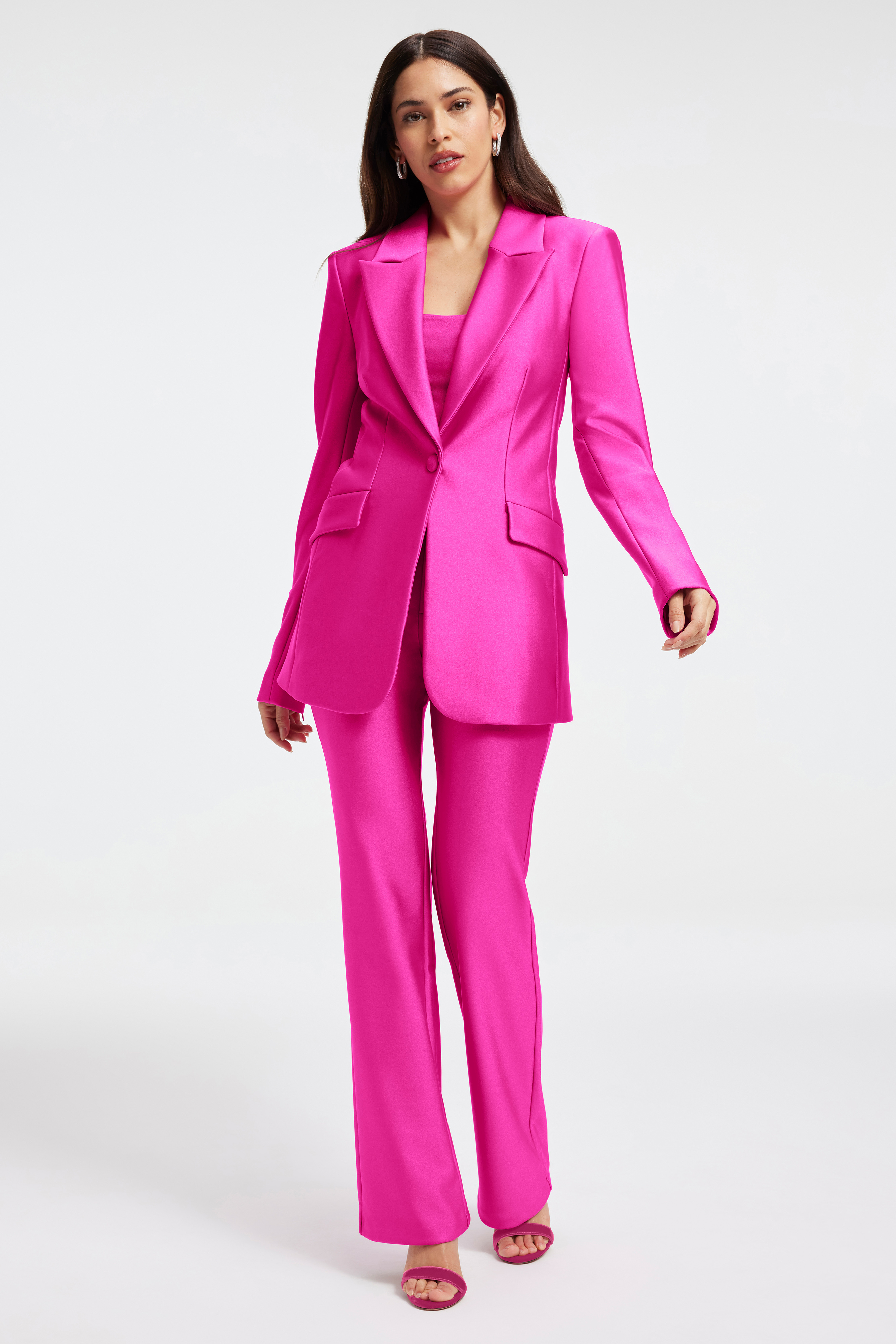 COMPRESSION SHINE BOOTCUT TROUSER in FUCHSIA PINK001 styled with our COMPRESSION SHINE SCULPTED BLAZER in FUCHSIA PINK001, COMPRESSION SHINE CORSET BODYSUIT in FUCHSIA PINK001, or SUPER STRETCH BABY TEE in FUCHSIA PINK001