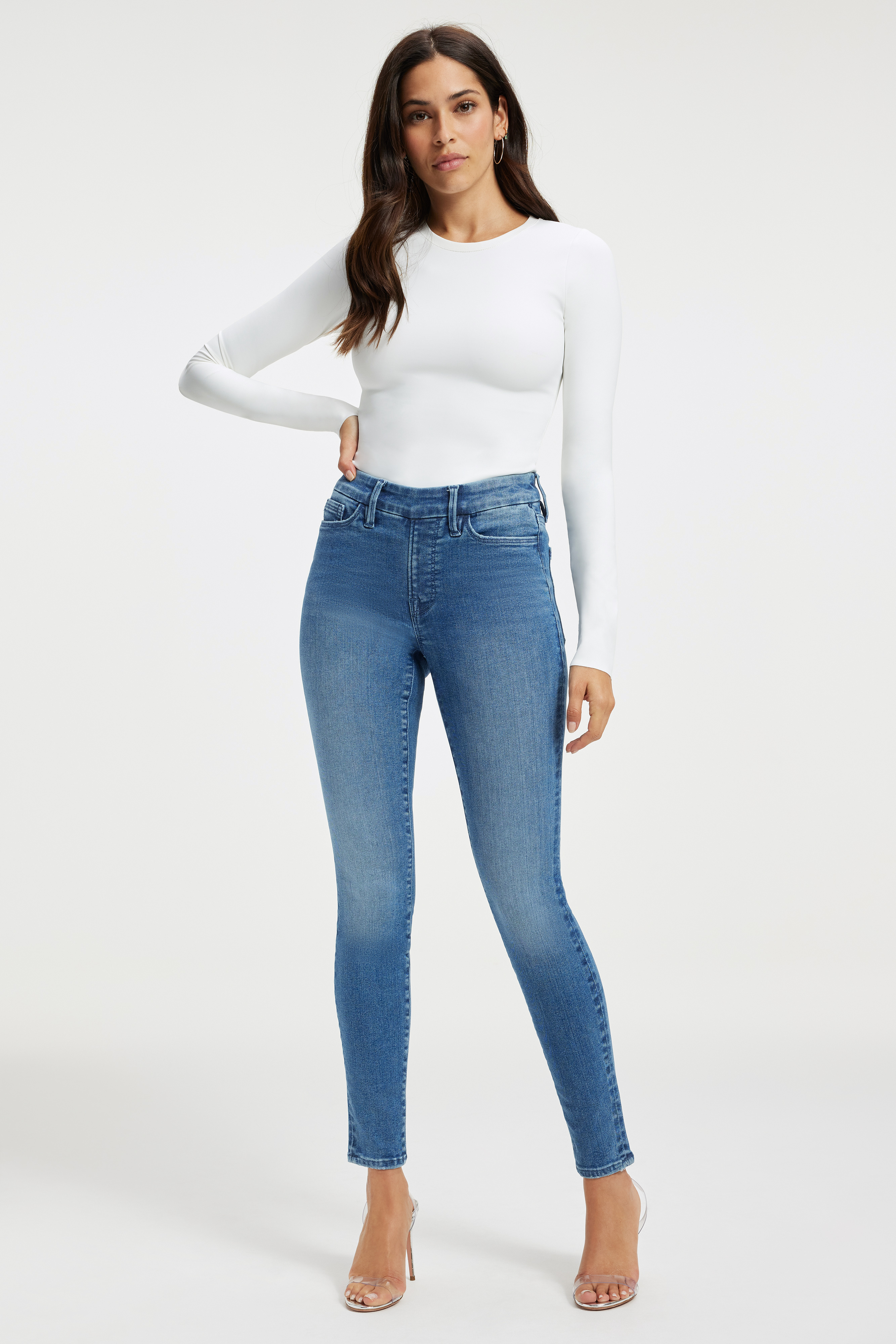 POWER STRETCH PULL-ON SKINNY JEANS in INDIGO490 styled with our SCUBA CREW BODYSUIT in WHITE001, SCUBA FUNNEL NECK BODYSUIT in WHITE001, or SCUBA MODERN TANK BODYSUIT in WHITE001