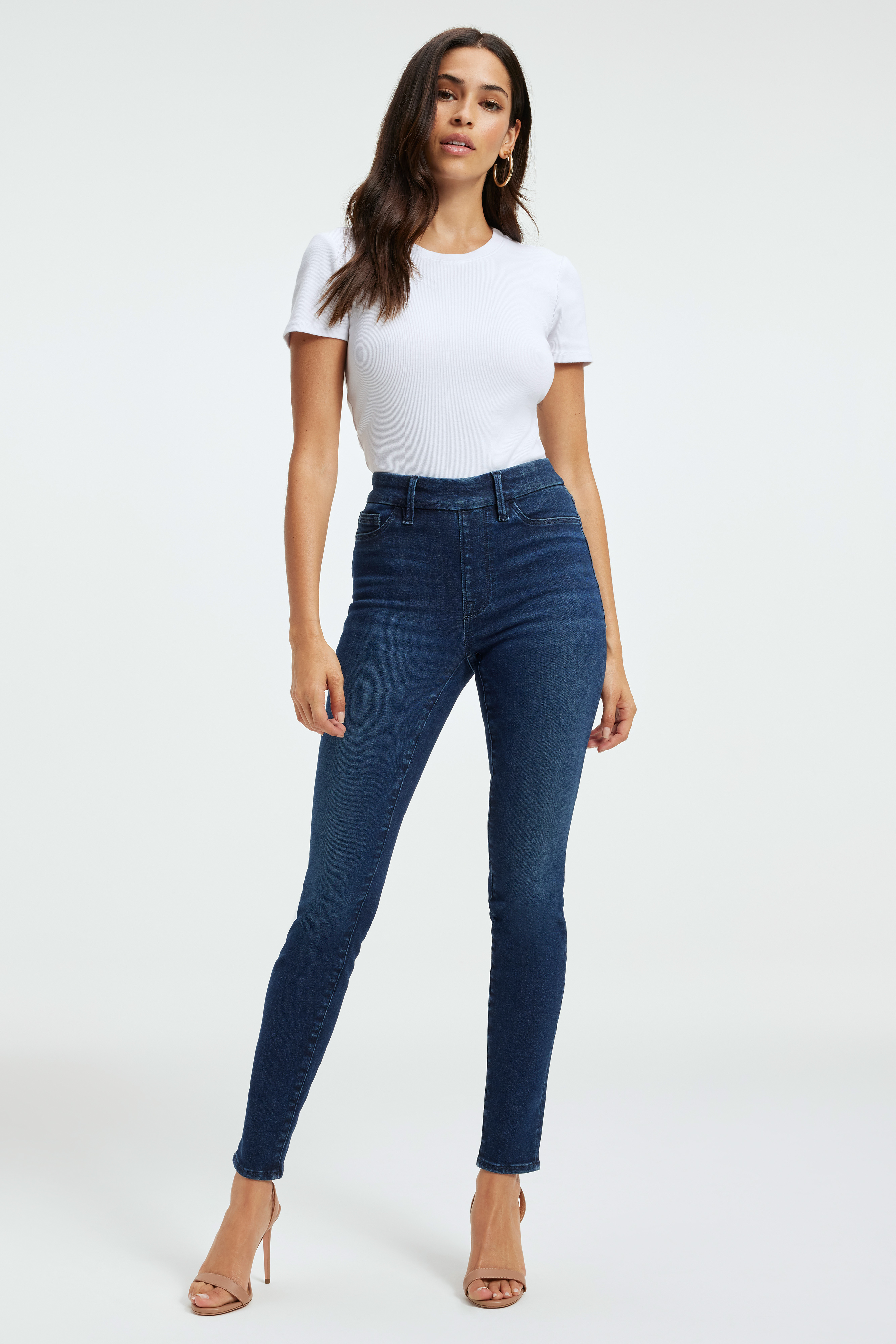 POWER STRETCH PULL-ON SKINNY JEANS in INDIGO491 styled with our SCUBA TEE BODYSUIT in WHITE001, SCUBA CREW BODYSUIT in WHITE001, or SCUBA FUNNEL NECK BODYSUIT in WHITE001