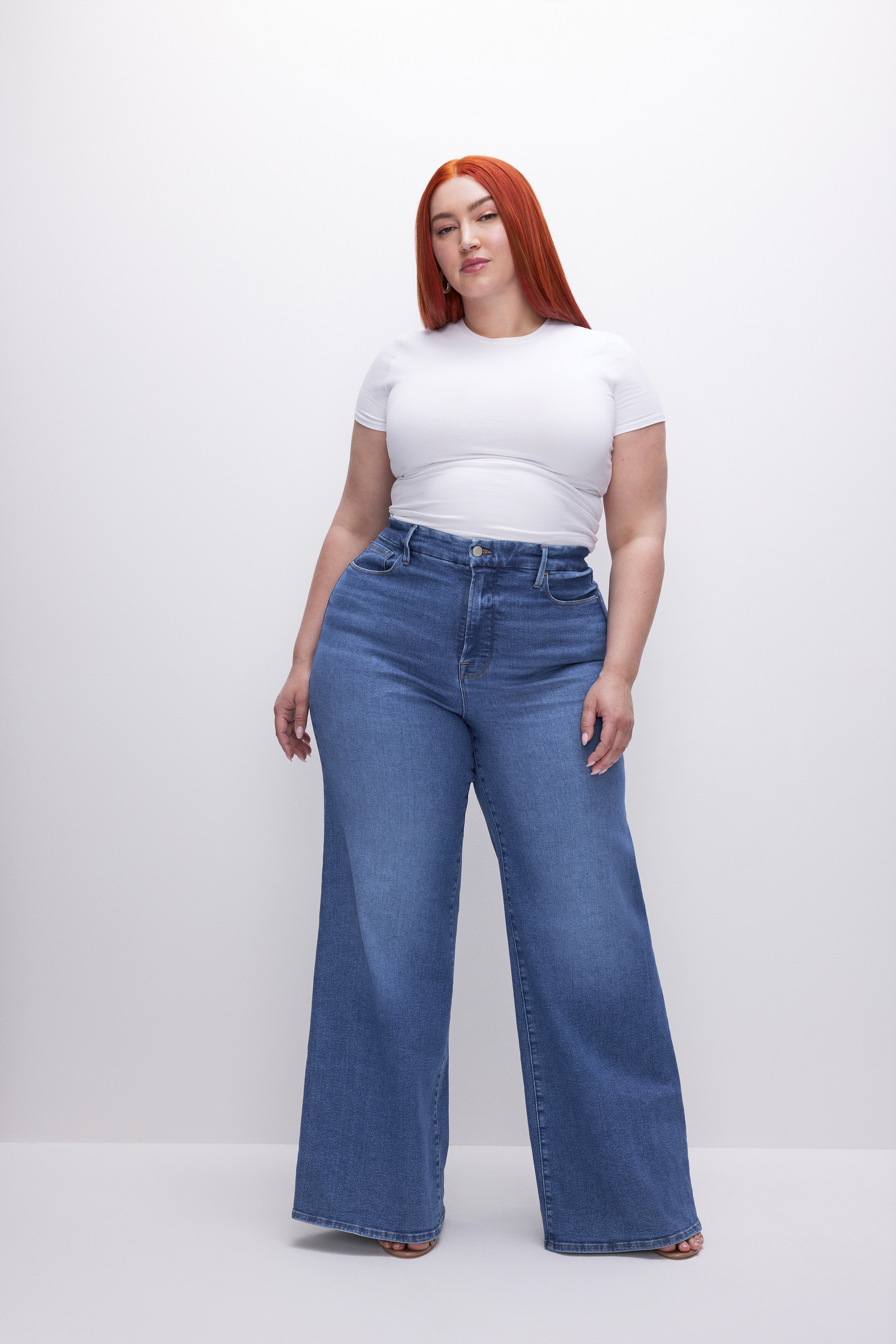 GOOD WAIST PALAZZO JEANS in INDIGO456 styled with our SUPER STRETCH BABY TEE in WHITE001, SCUBA TEE BODYSUIT in WHITE001, or SCUBA MODERN TANK BODYSUIT in WHITE001