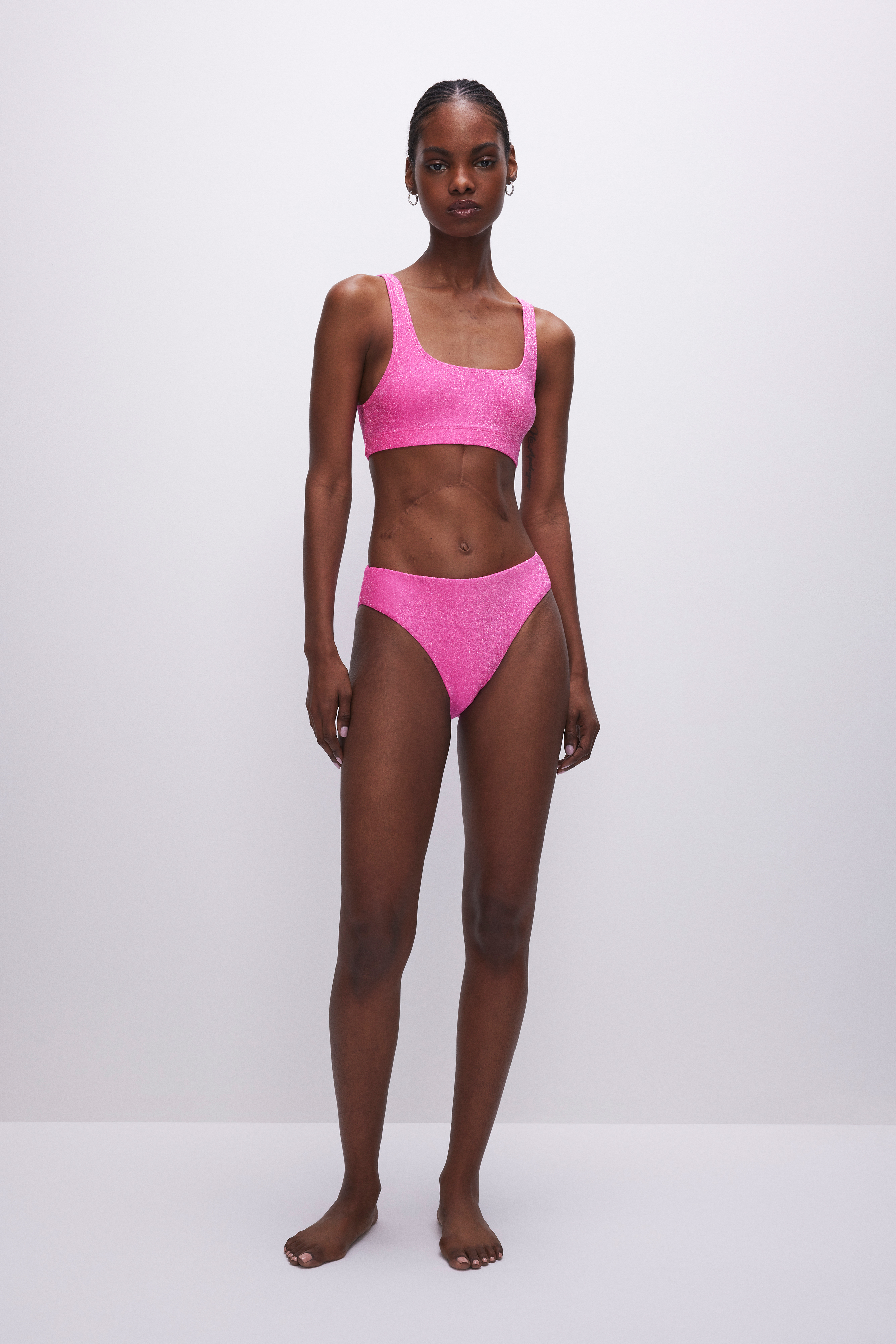 SPARKLE BIKINI BOTTOM in KNOCKOUTPINK001 styled with our SPARKLE SCOOP BIKINI TOP in KNOCKOUTPINK001, SPARKLE DEMI CUP BIKINI TOP in KNOCKOUTPINK001, or SPARKLE TINY TIES BIKINI TOP in KNOCKOUTPINK001