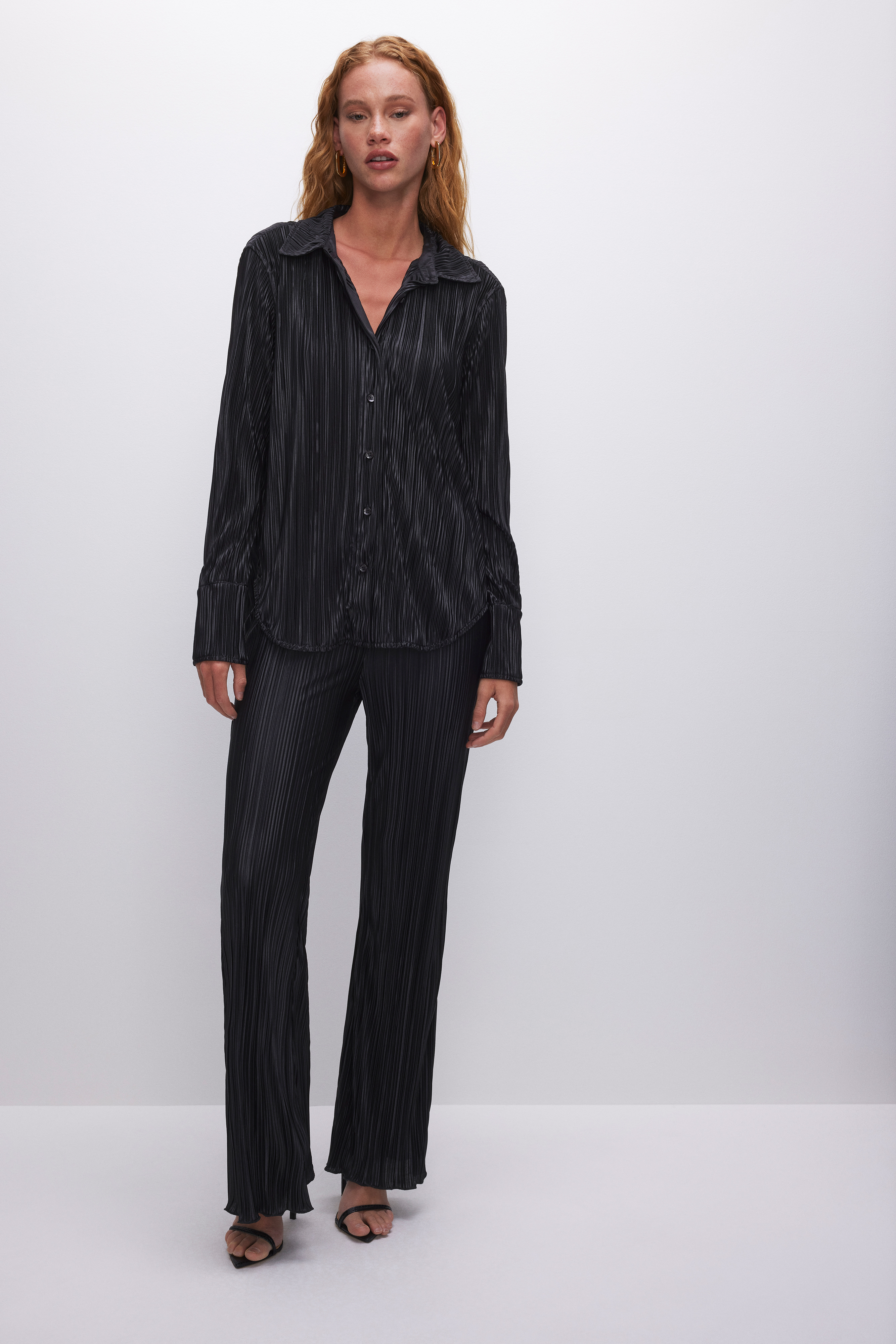 ALWAYS FITS PLISSÉ SHIRT in BLACK001 styled with our ALWAYS FITS PLISSÉ PANTS in BLACK001, ALWAYS FITS PLISSÉ SHORTS in BLACK001, or ALWAYS FITS PLISSÉ MAXI SKIRT in BLACK001