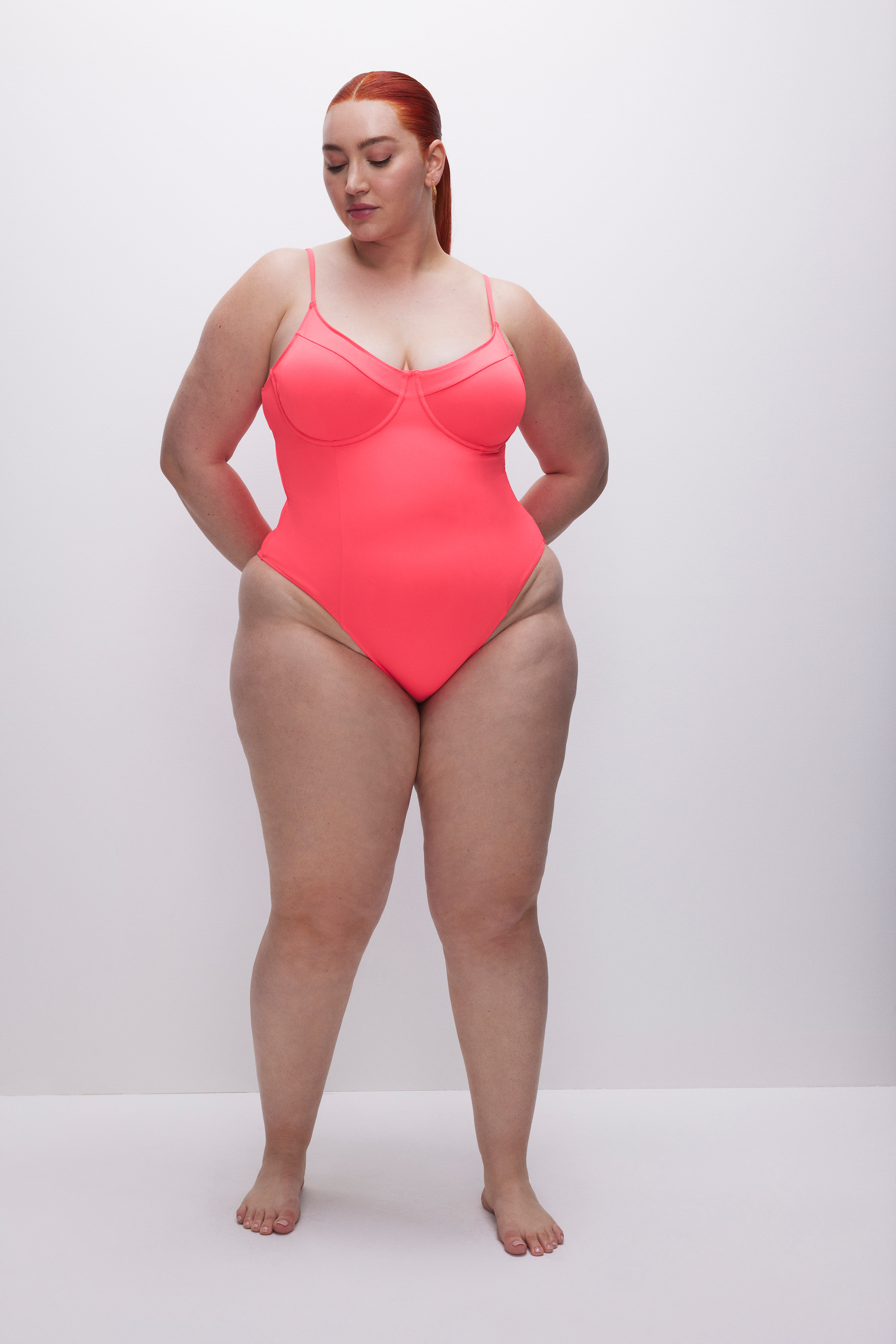 COMPRESSION SHOWOFF SWIMSUIT in FIERY CORAL 002 styled with our MESH TWIST SARONG in FIERY CORAL 002,