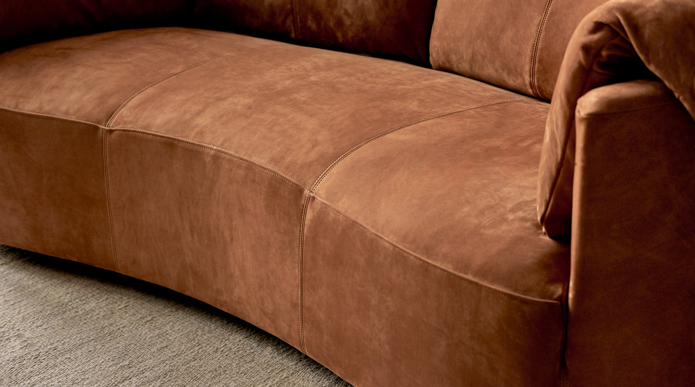 Close up of Loula Leather Sofa in Meridian Leather, Sunset Canyon