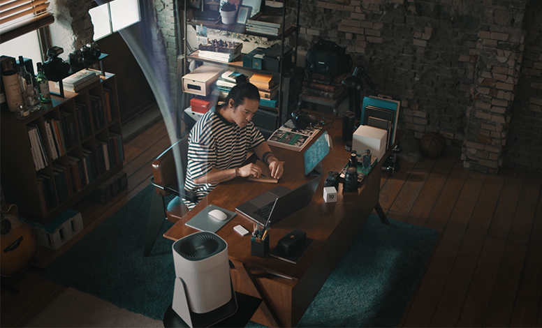 Airmega Aim in the home office with a working man