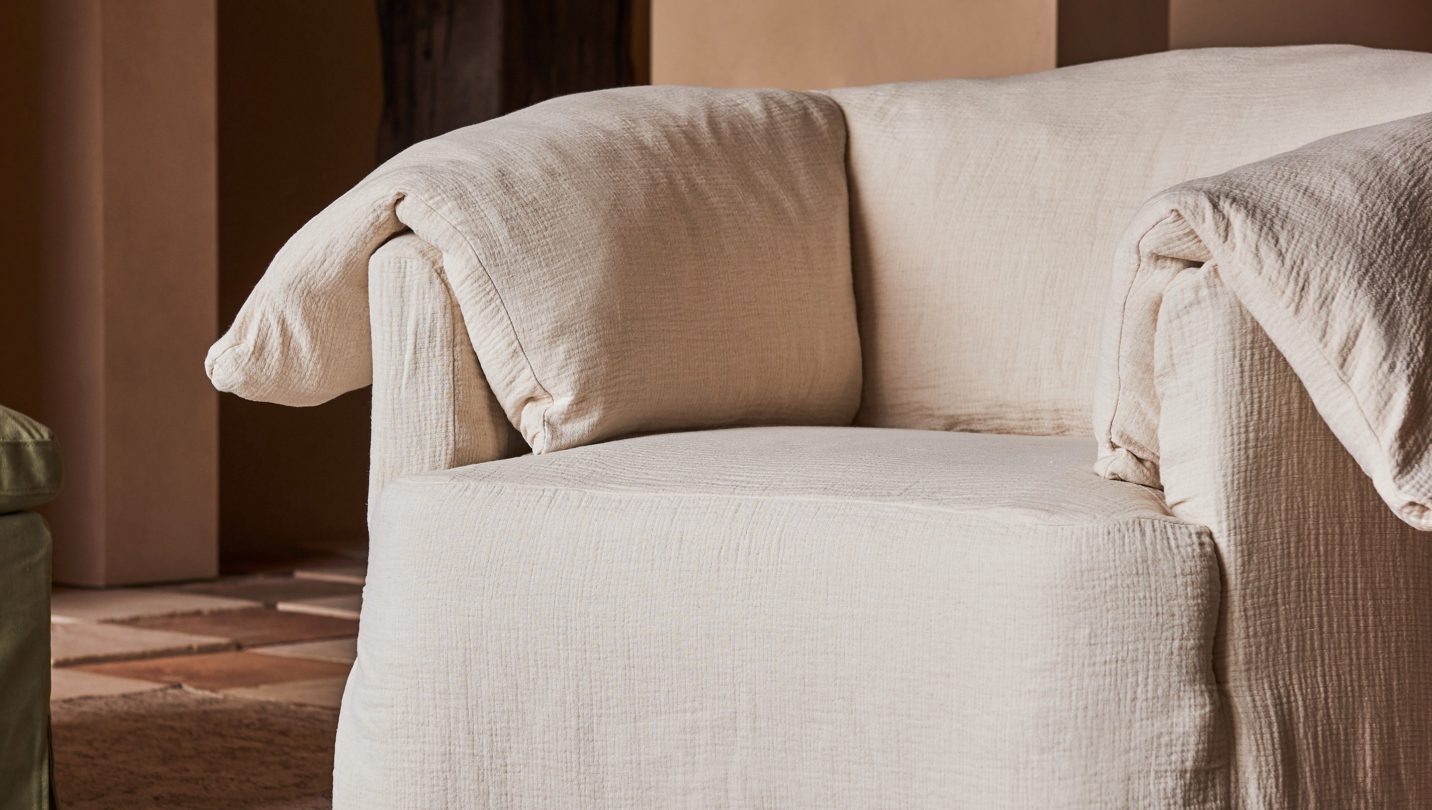 Close-up view of Loula Swivel Chair in Washed Cotton Linen Corn Silk