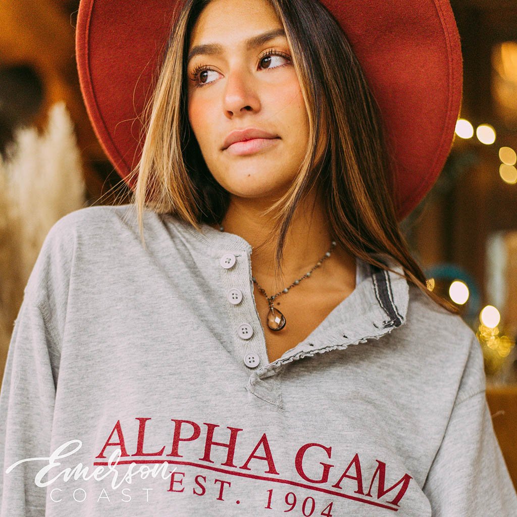 girl wearing a pi phi ash gray sweatshirt